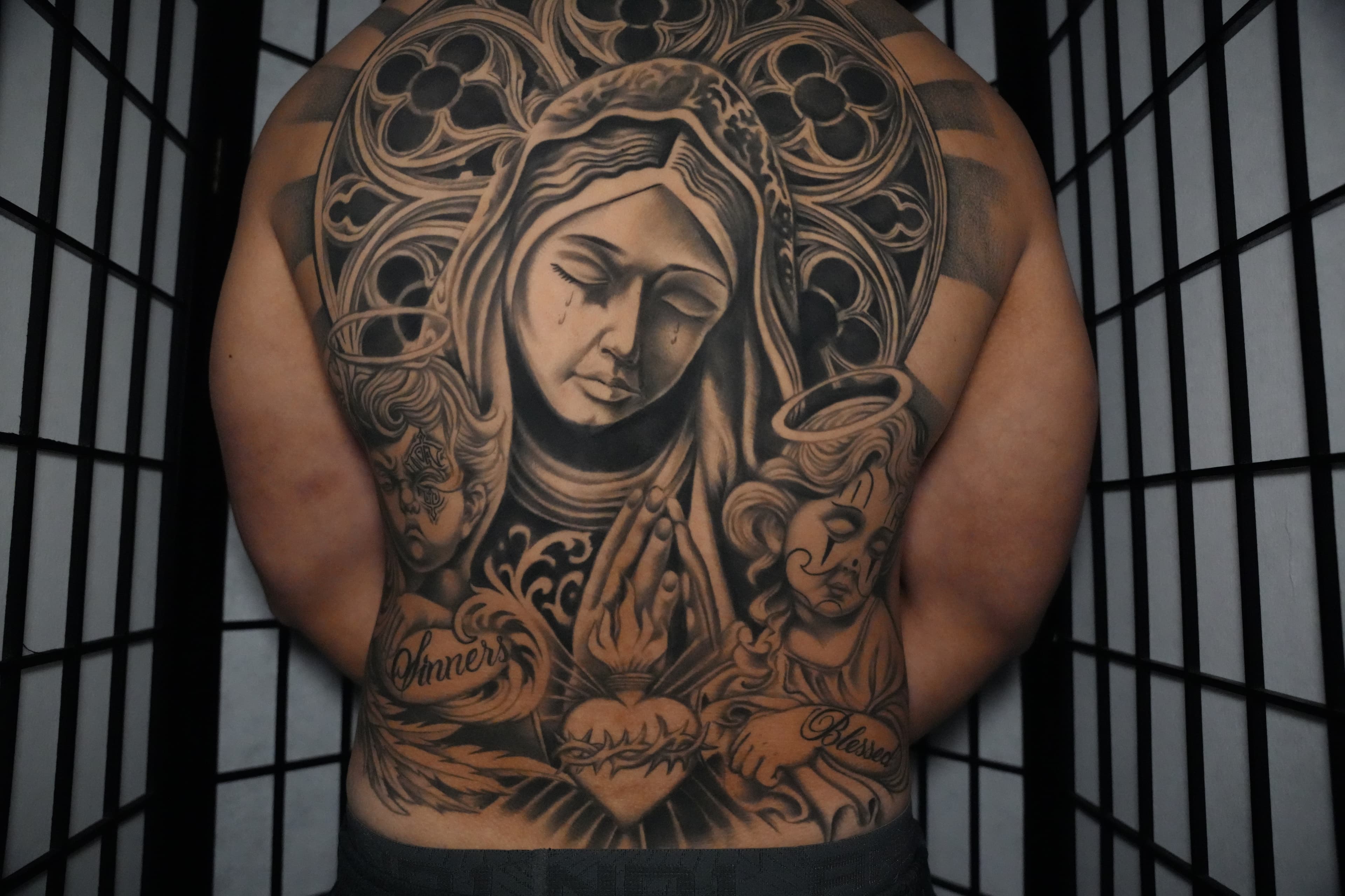 Black and grey Virgin Mary realism back piece by Hawaii tattoo artist Isaac Mackenzie at TNT Tattoo, Aiea, Oahu