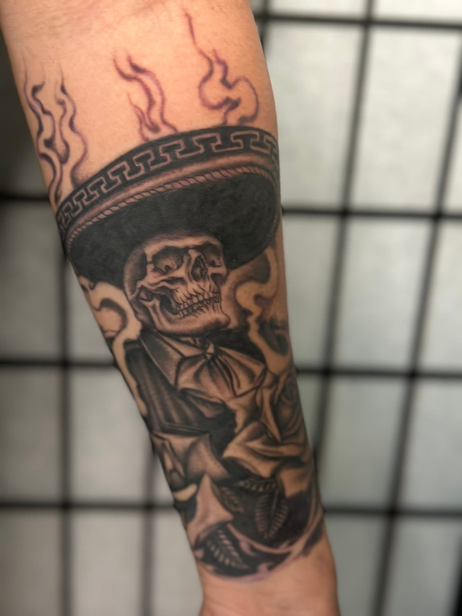 Chicano skeleton mariachi tattoo by Isaac Mackenzie, Oahu