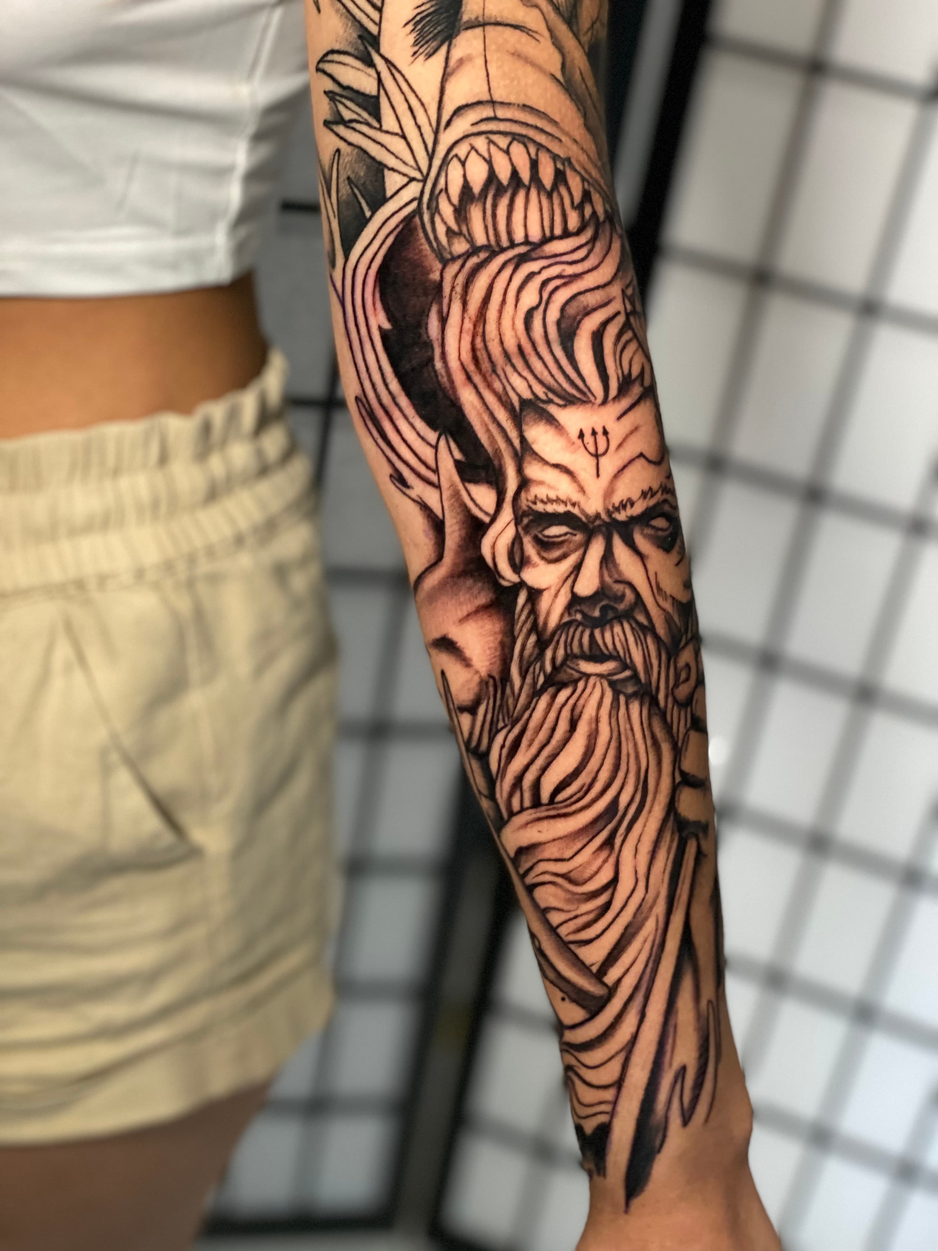 Custom Poseidon sleeve tattoo by Isaac Mackenzie at TNT Tattoo, Aiea