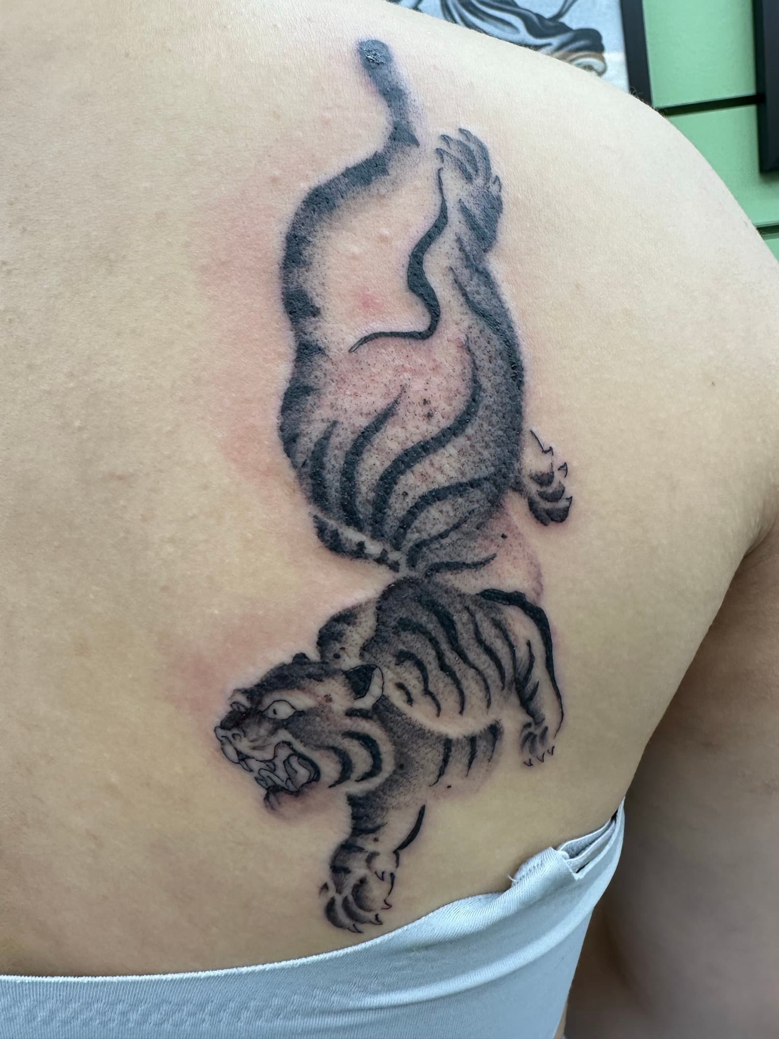 Custom stipple-style tiger tattoo by Isaac Mackenzie, Hawaii