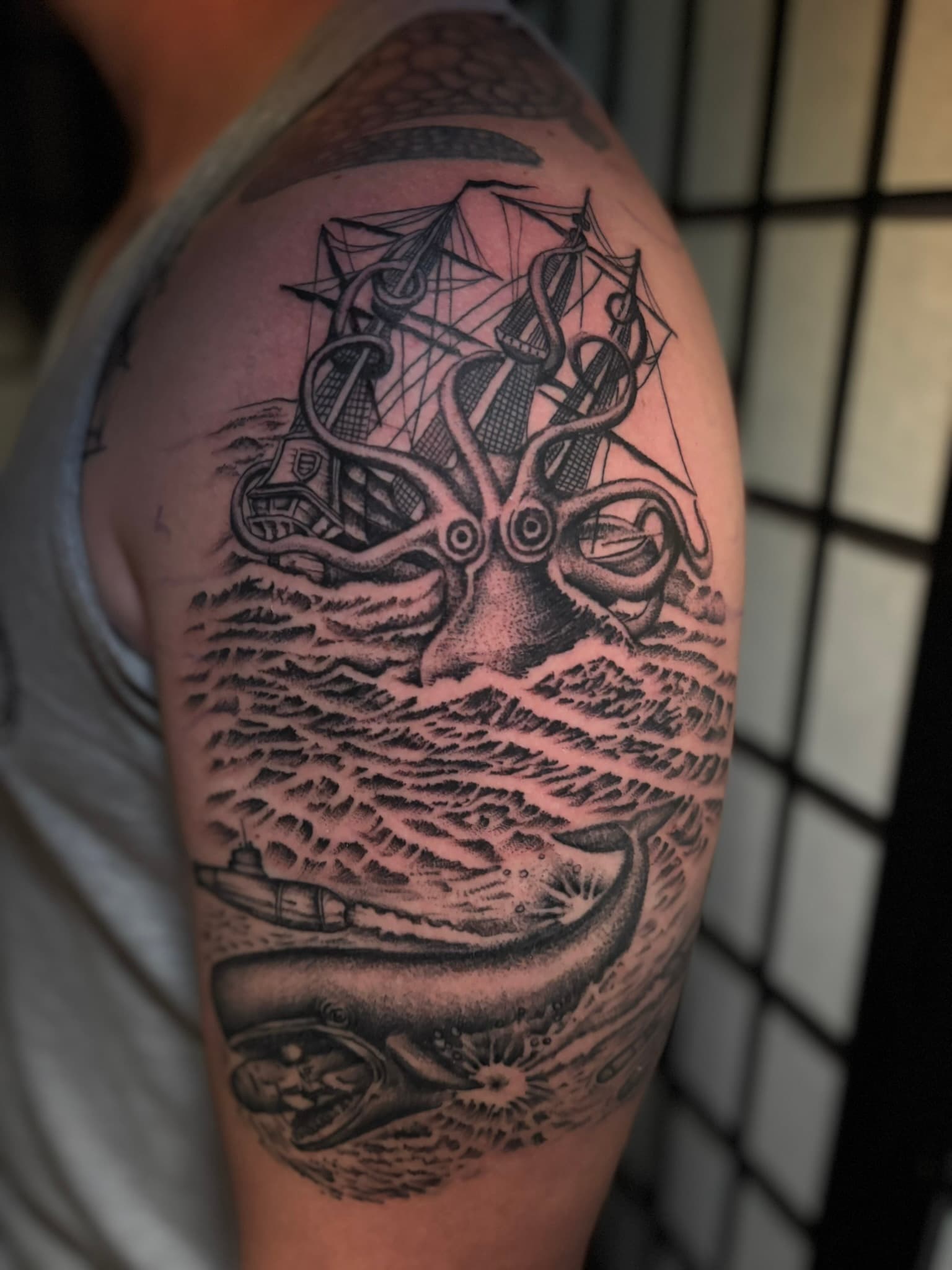 Fine line kraken and submarine whale battle tattoo by Isaac Mackenzie