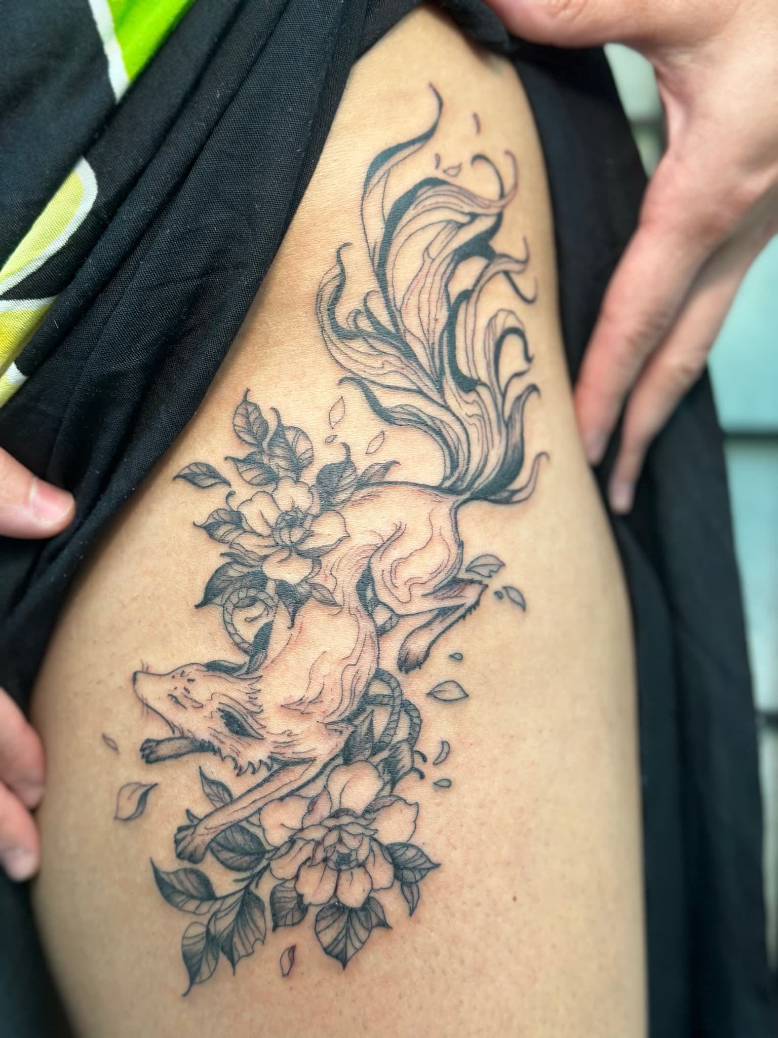 Fine line fox with florals tattoo by Isaac Mackenzie, Oahu