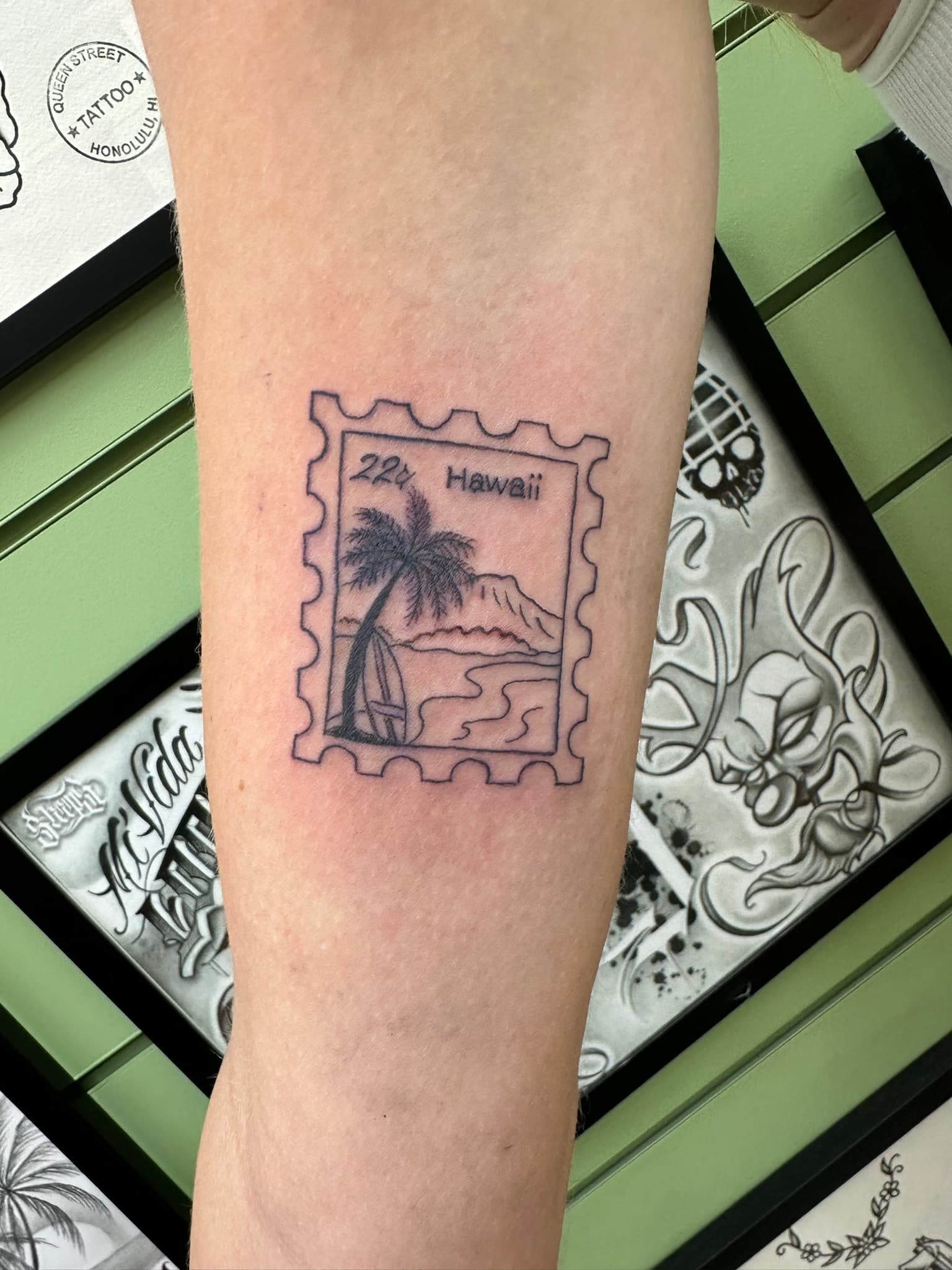 Fine line Hawaii postage stamp tattoo by Isaac Mackenzie, Oahu
