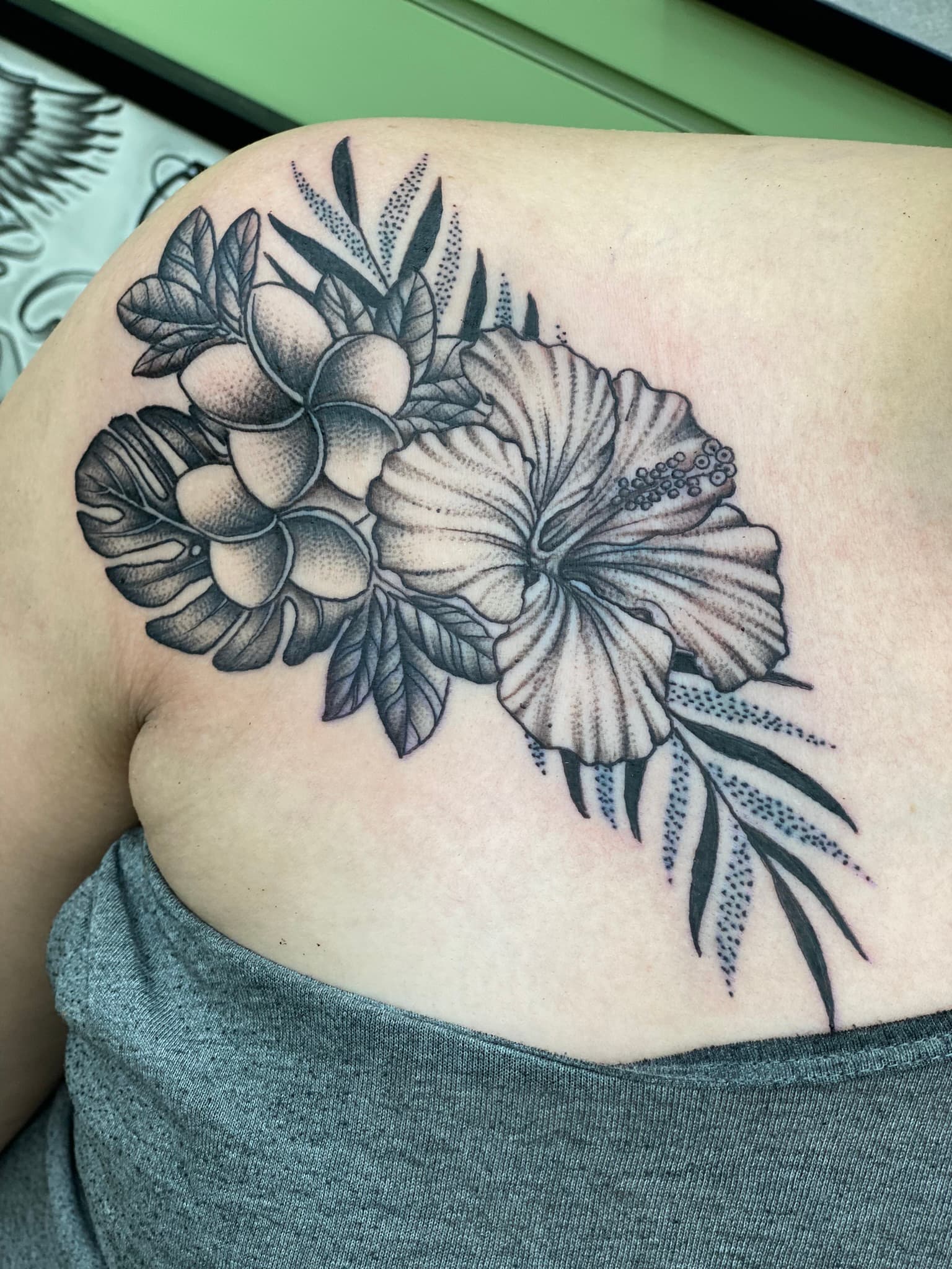 Fine line Hawaiian floral shoulder and chest tattoo by Isaac Mackenzie at TNT Tattoo, Aiea, Oahu