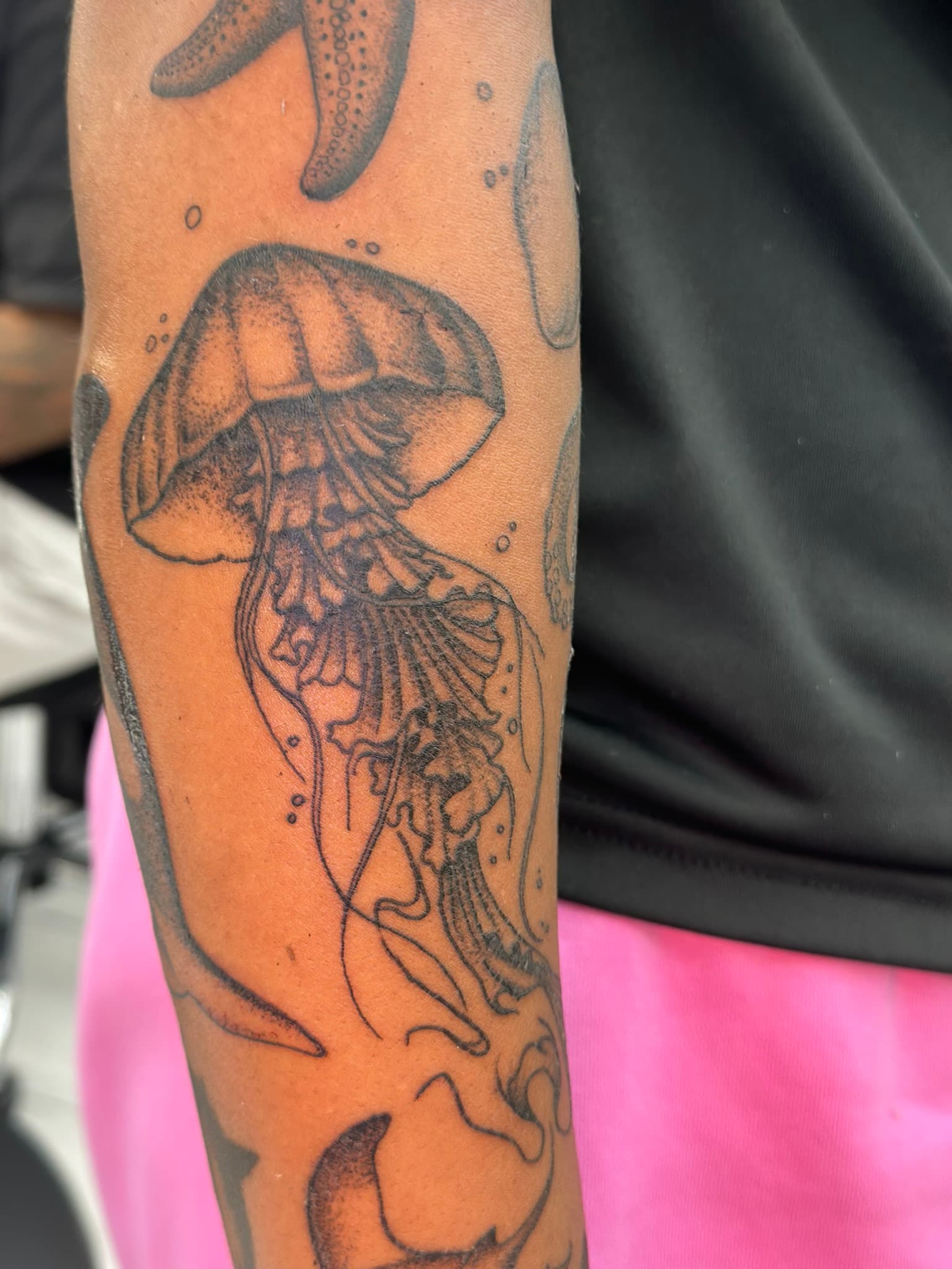 Fine line jellyfish, part of an aquatic sleeve, by Isaac Mackenzie, Oahu