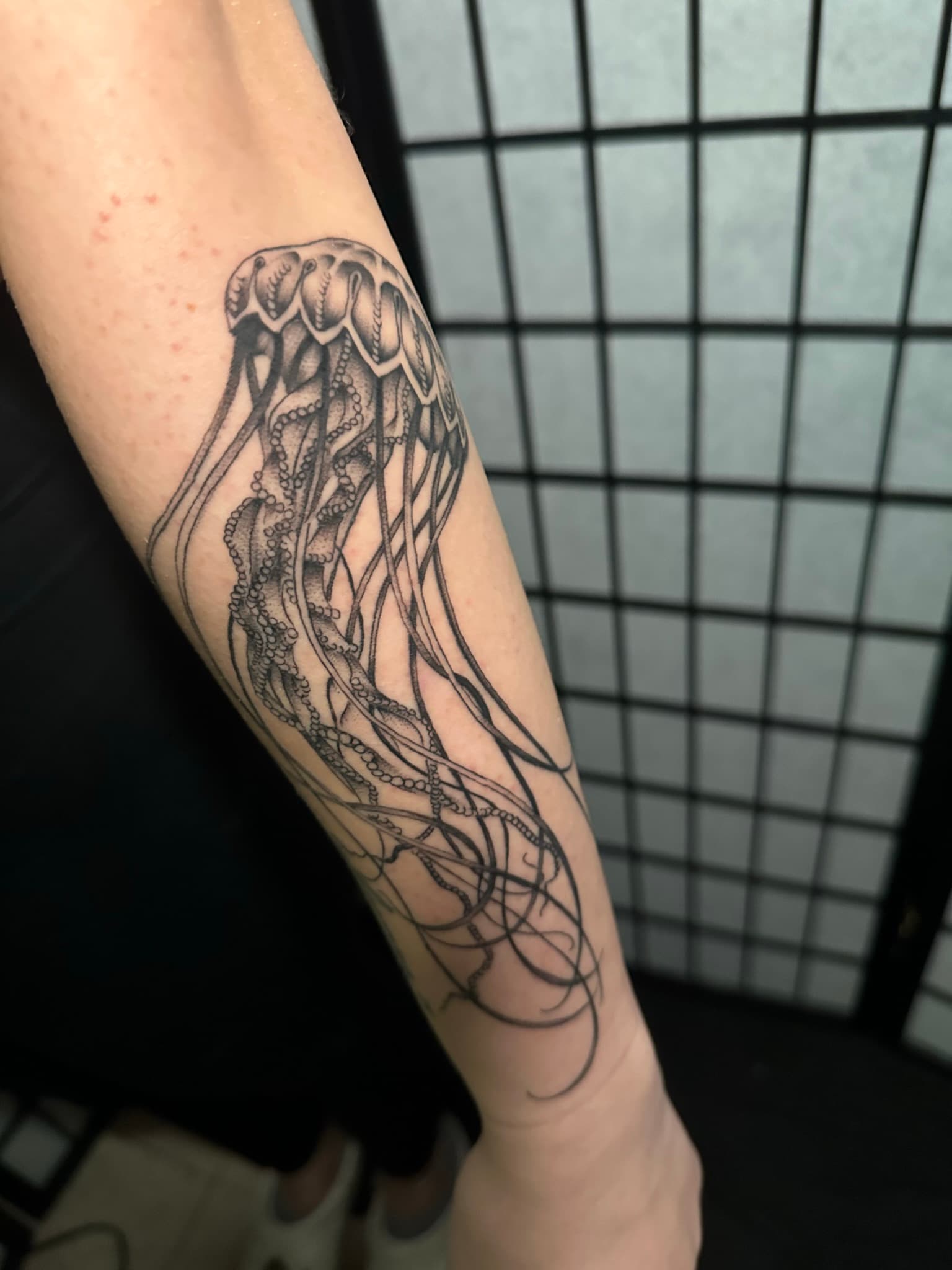 Fine line jellyfish tattoo by Isaac Mackenzie, Hawaii