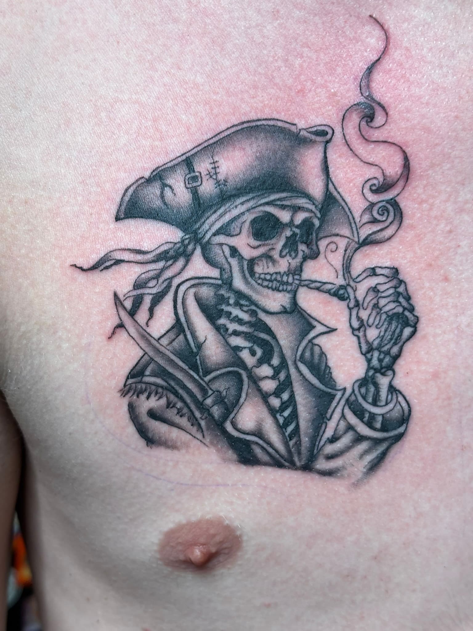 Fine line smoking pirate tattoo by Isaac Mackenzie, Oahu