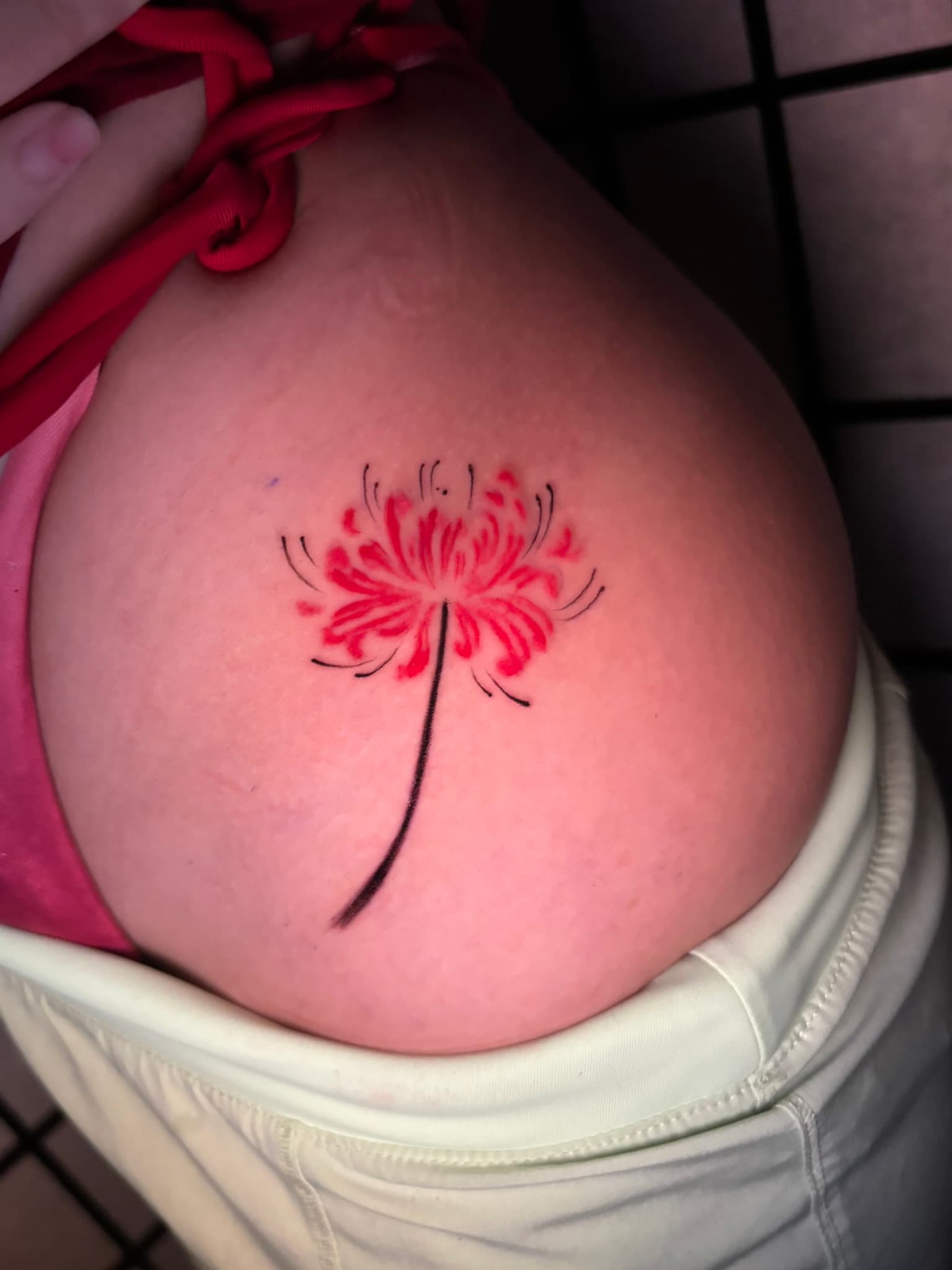 Fine line spider lily tattoo by Isaac Mackenzie, Hawaii