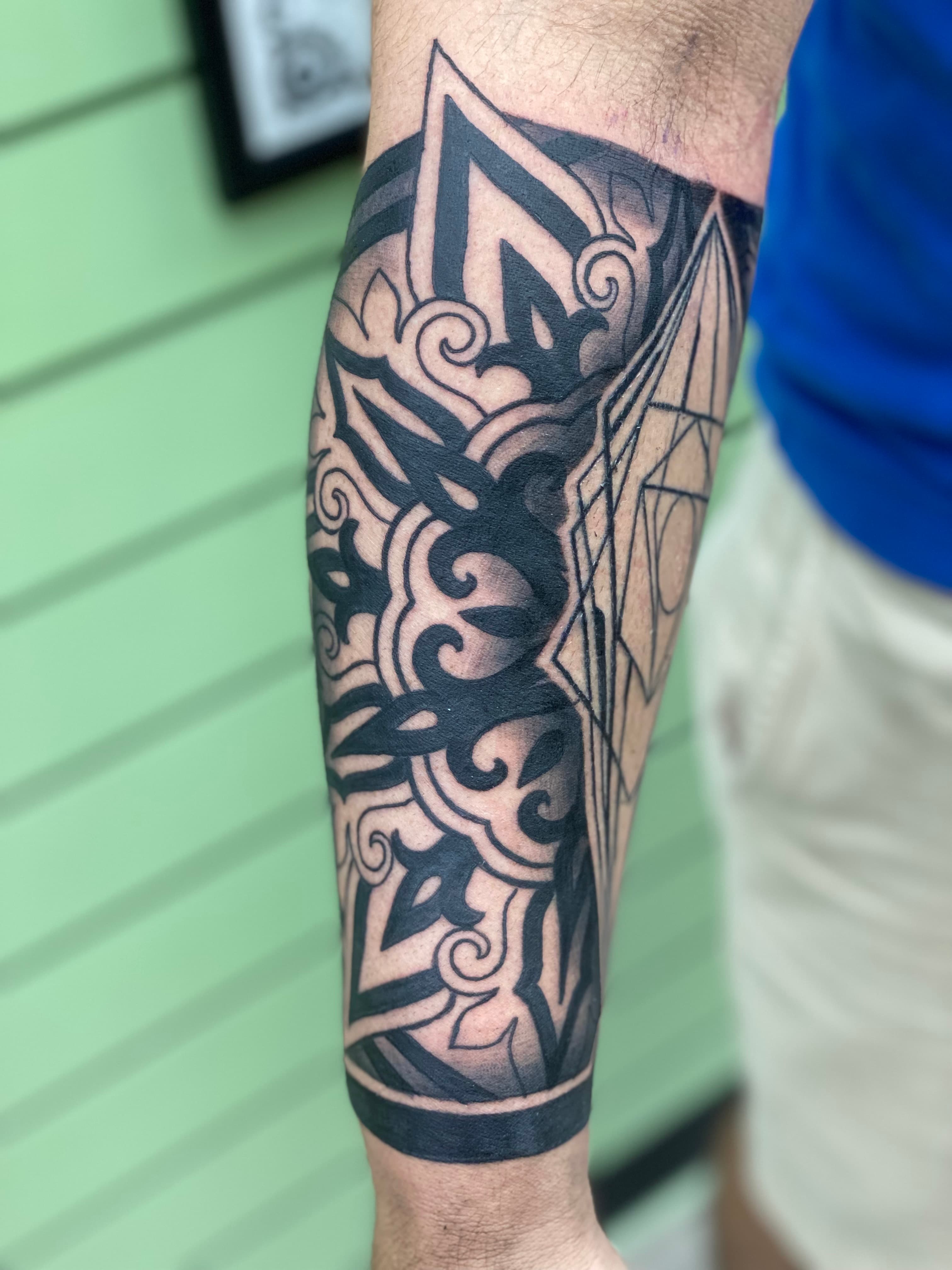 Angular geometric mandala tattoo by Isaac Mackenzie, Oahu