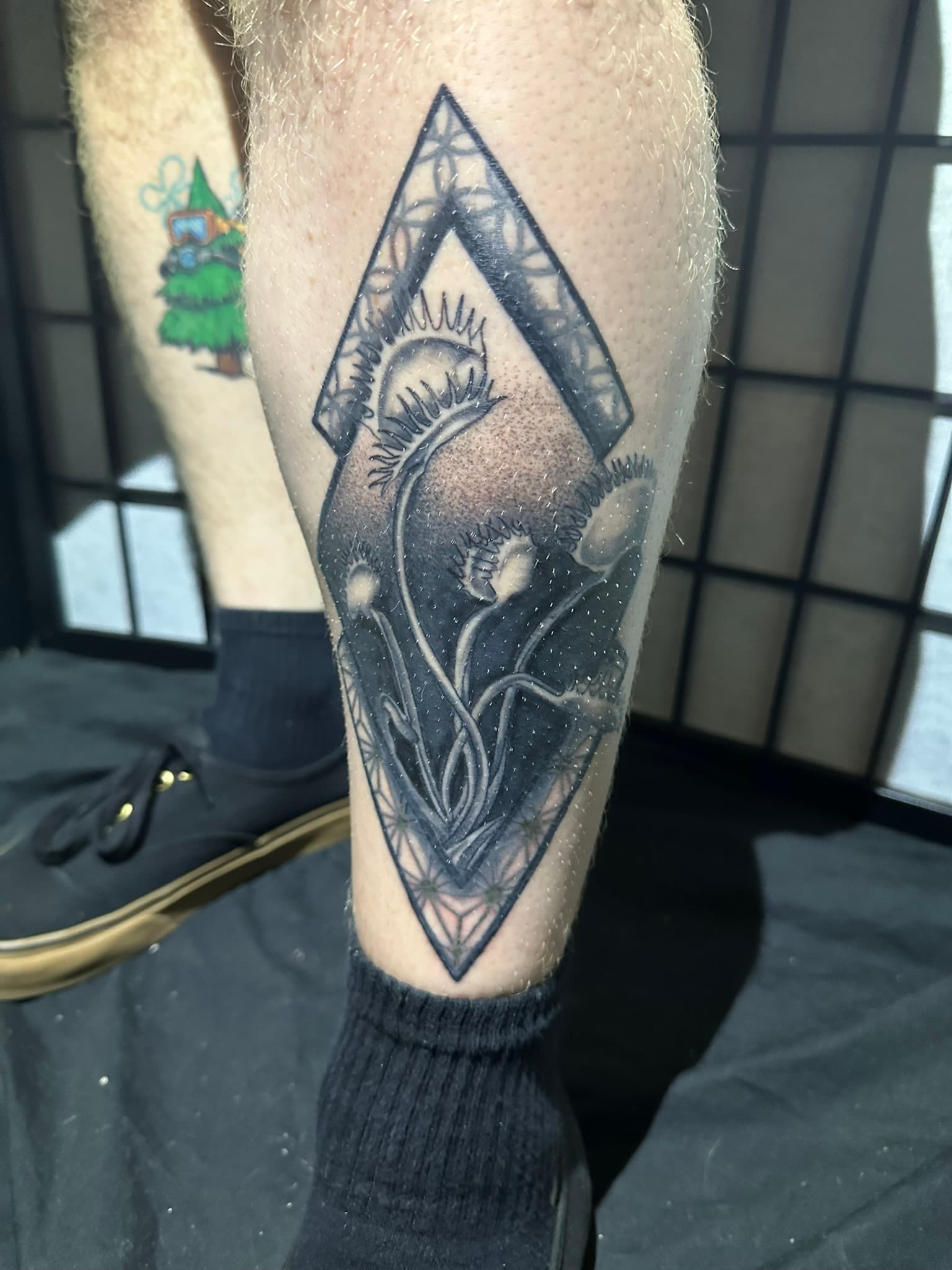Geometric Venus flytrap tattoo by Isaac Mackenzie, Oahu