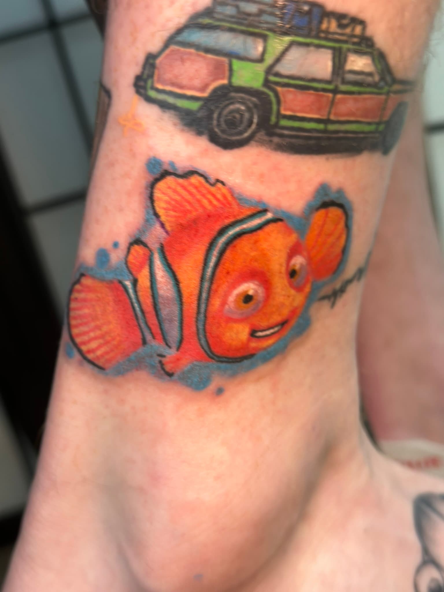 Illustrative color clownfish tattoo by Isaac Mackenzie