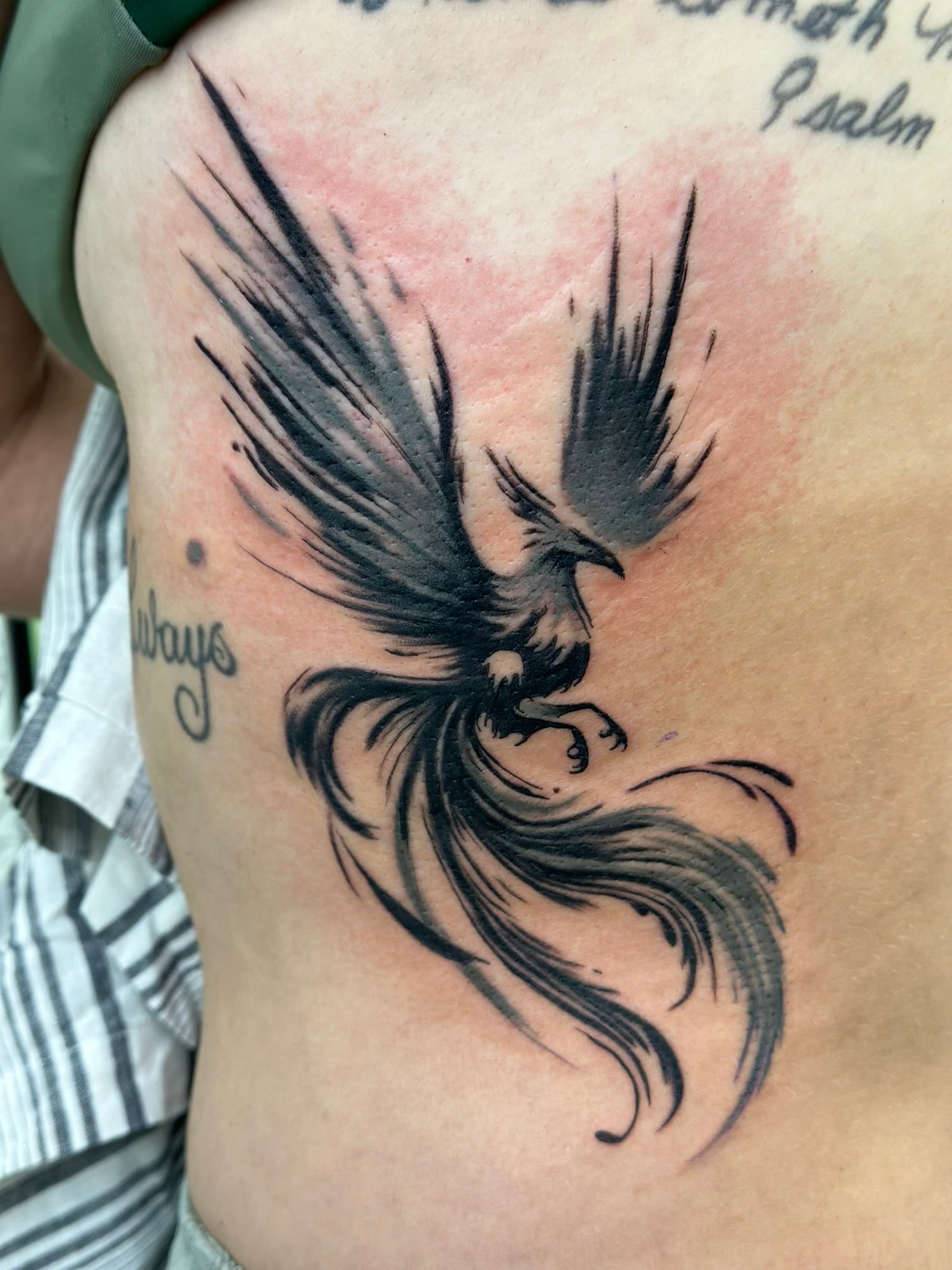 Illustrative grey phoenix tattoo by Isaac Mackenzie, Oahu