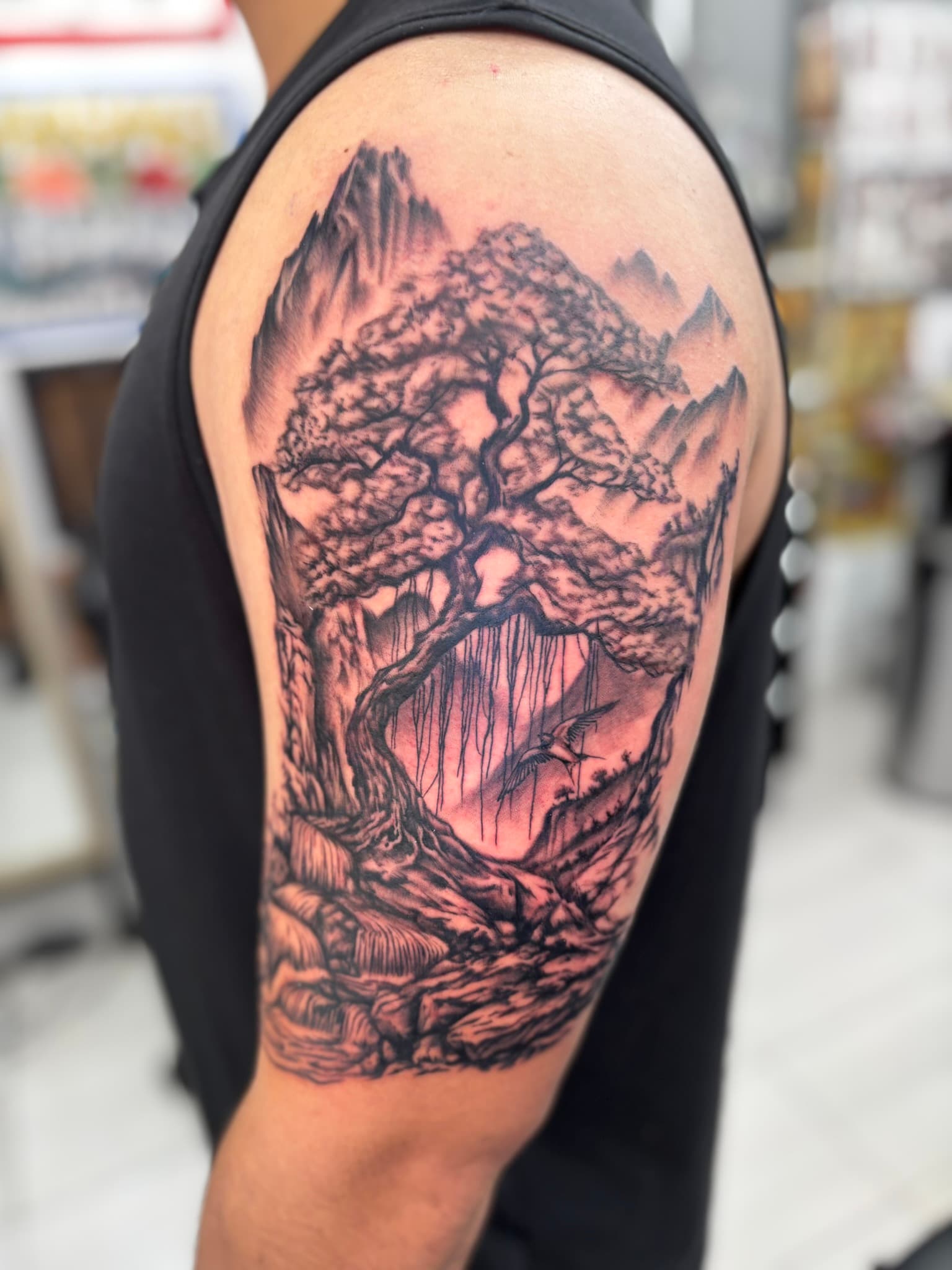 Japanese realism bonsai tree and mountains tattoo by Isaac Mackenzie, Oahu