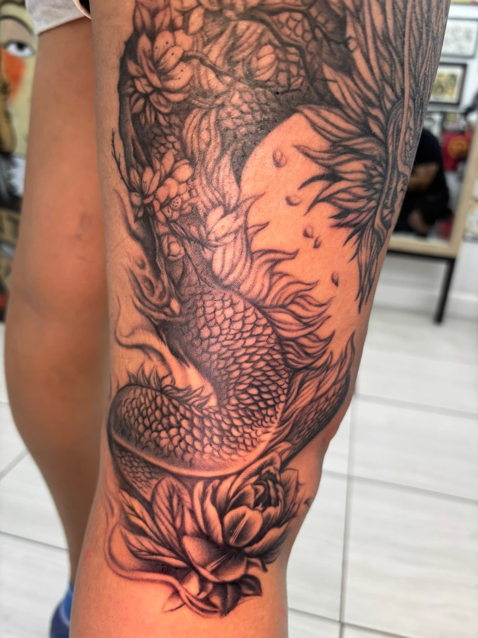 Japanese realism dragon, cherry blossoms, lotus tattoo by Isaac Mackenzie, Hawaii