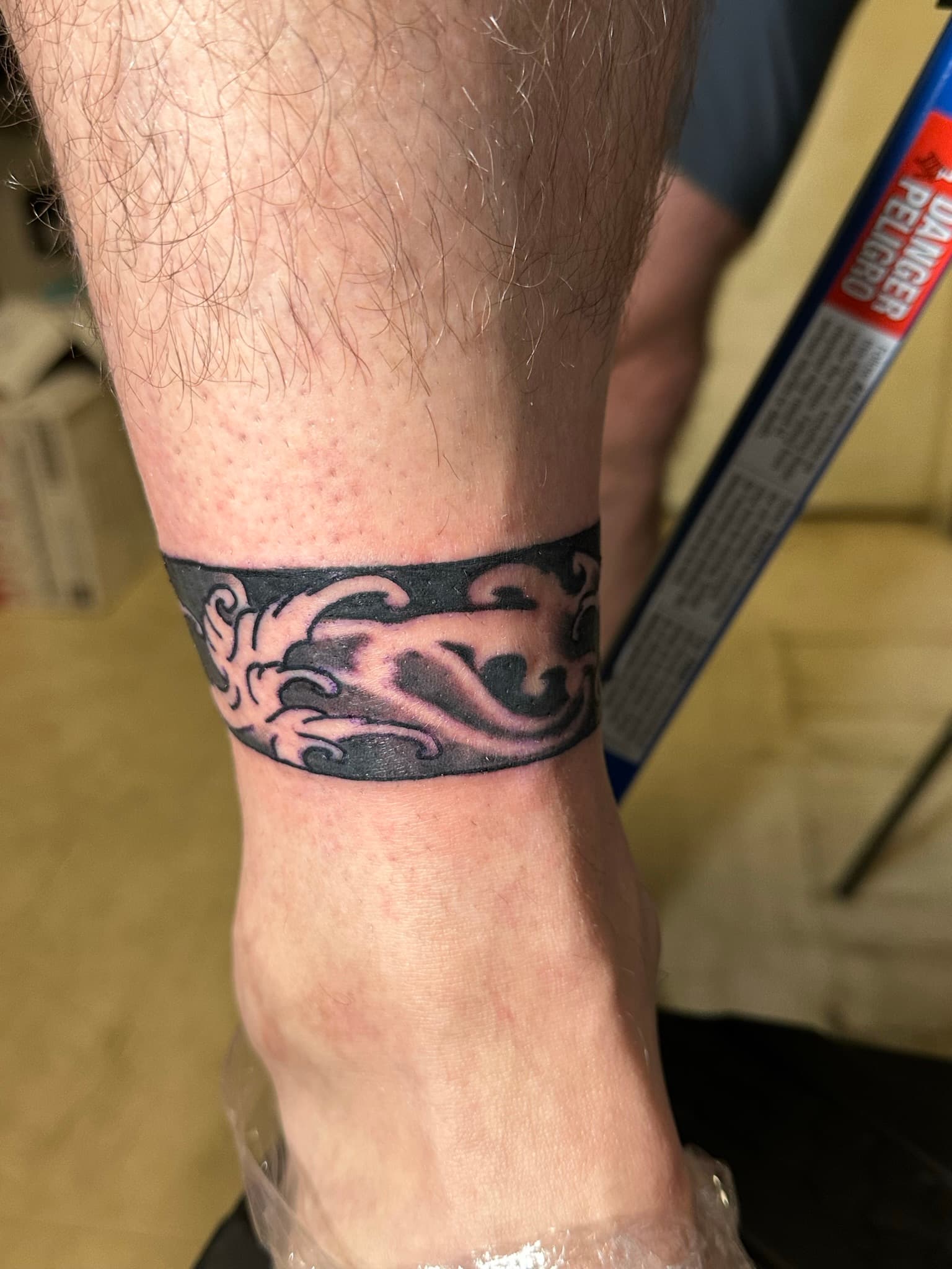 Japanese traditional finger wave ankle band tattoo by Isaac Mackenzie, Oahu