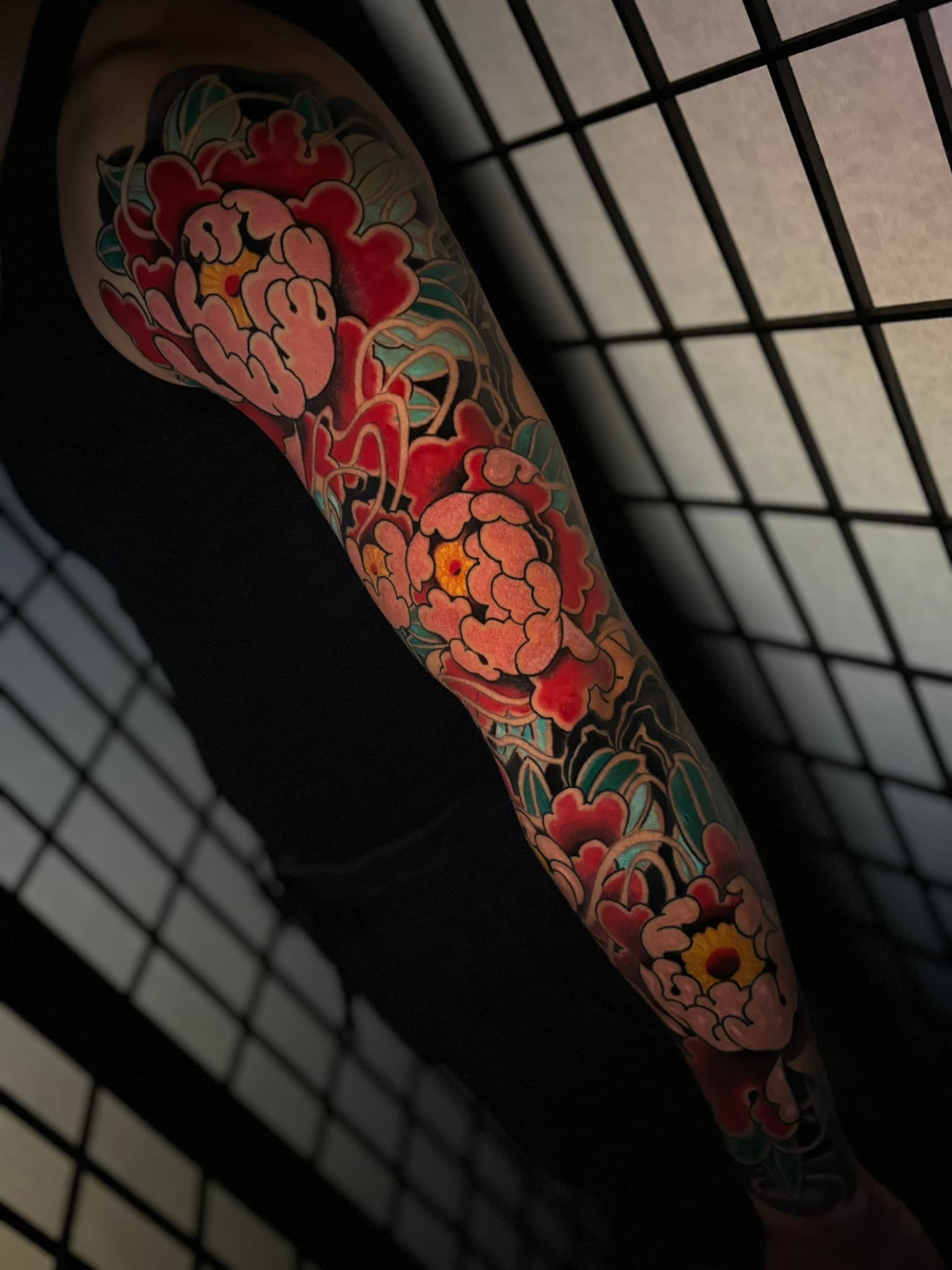 Japanese traditional peony color sleeve tattoo by Isaac Mackenzie at TNT Tattoo, Aiea, Oahu