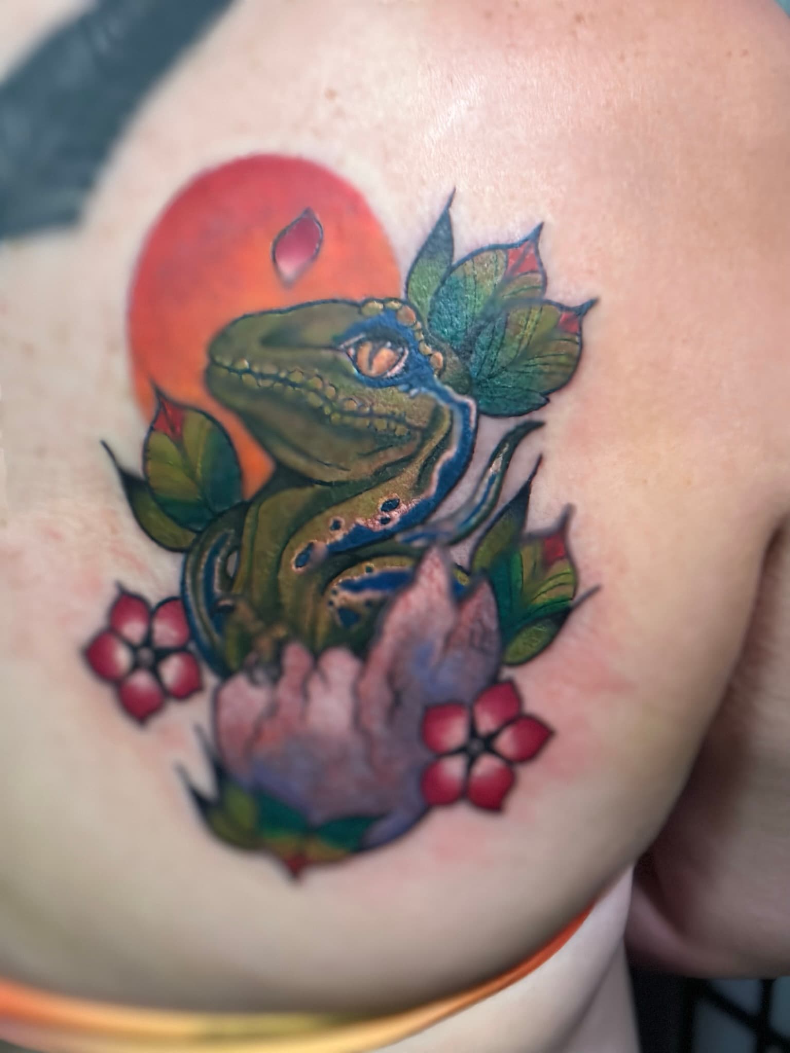 Neo-traditional color baby raptor dinosaur tattoo by Isaac Mackenzie, Oahu