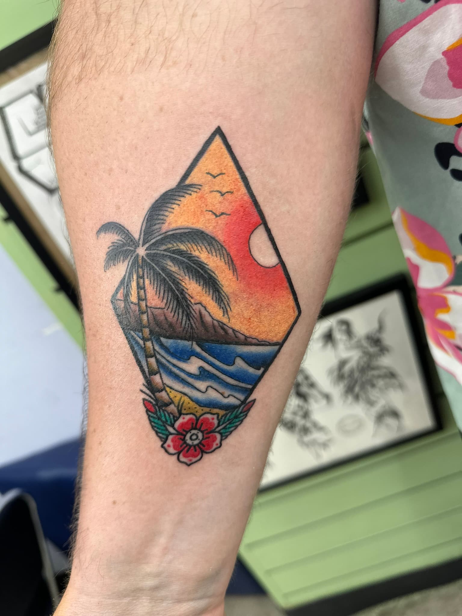 Neo-traditional color island view tattoo by Isaac Mackenzie, Hawaii