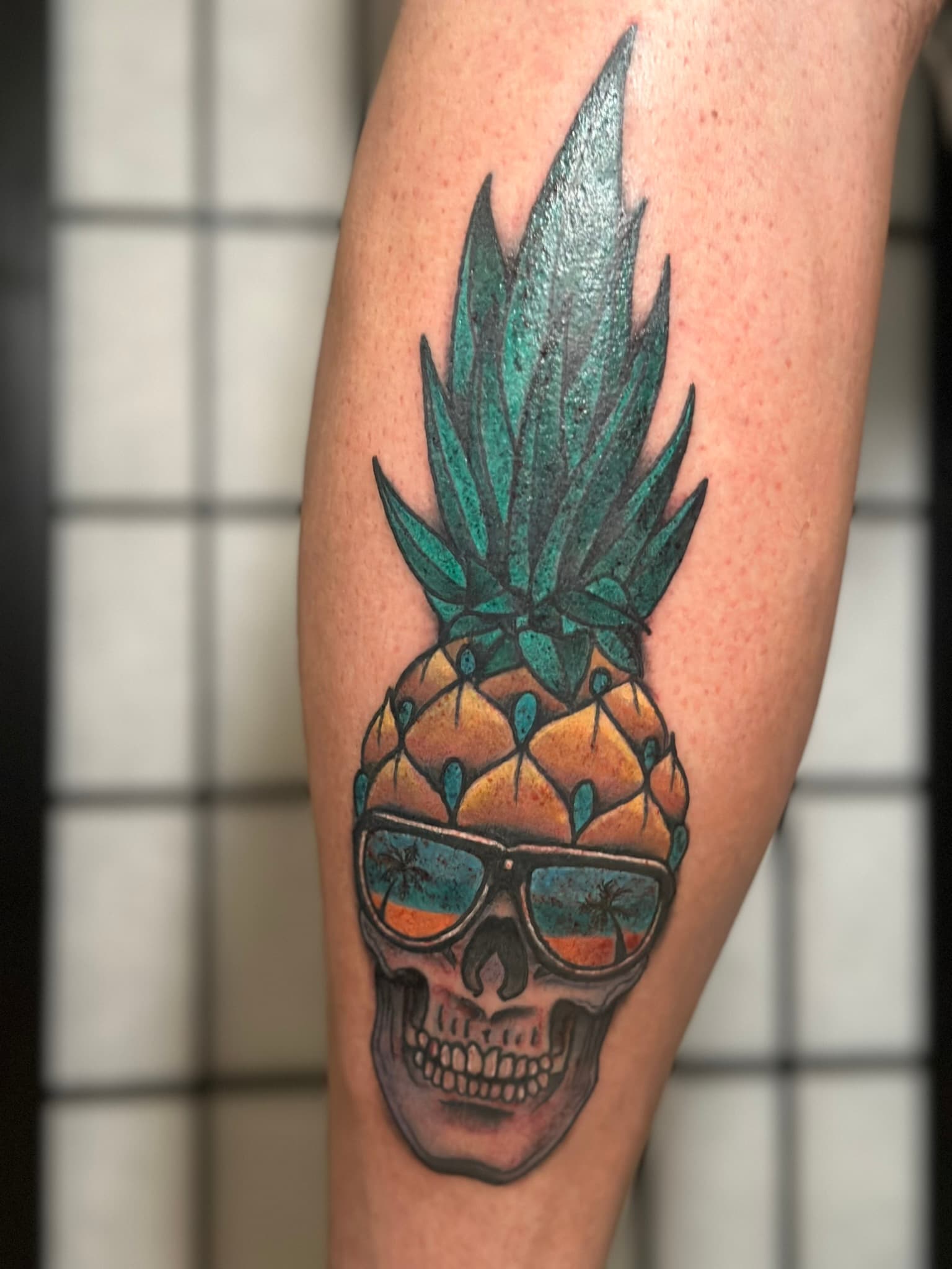 Neo-traditional color pineapple skull tattoo by Isaac Mackenzie at TNT Tattoo, Aiea, Oahu