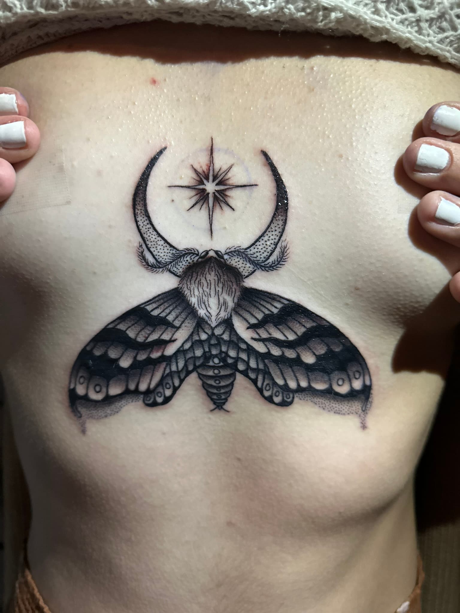 Neo-traditional night moth underboob tattoo by Isaac Mackenzie, Oahu