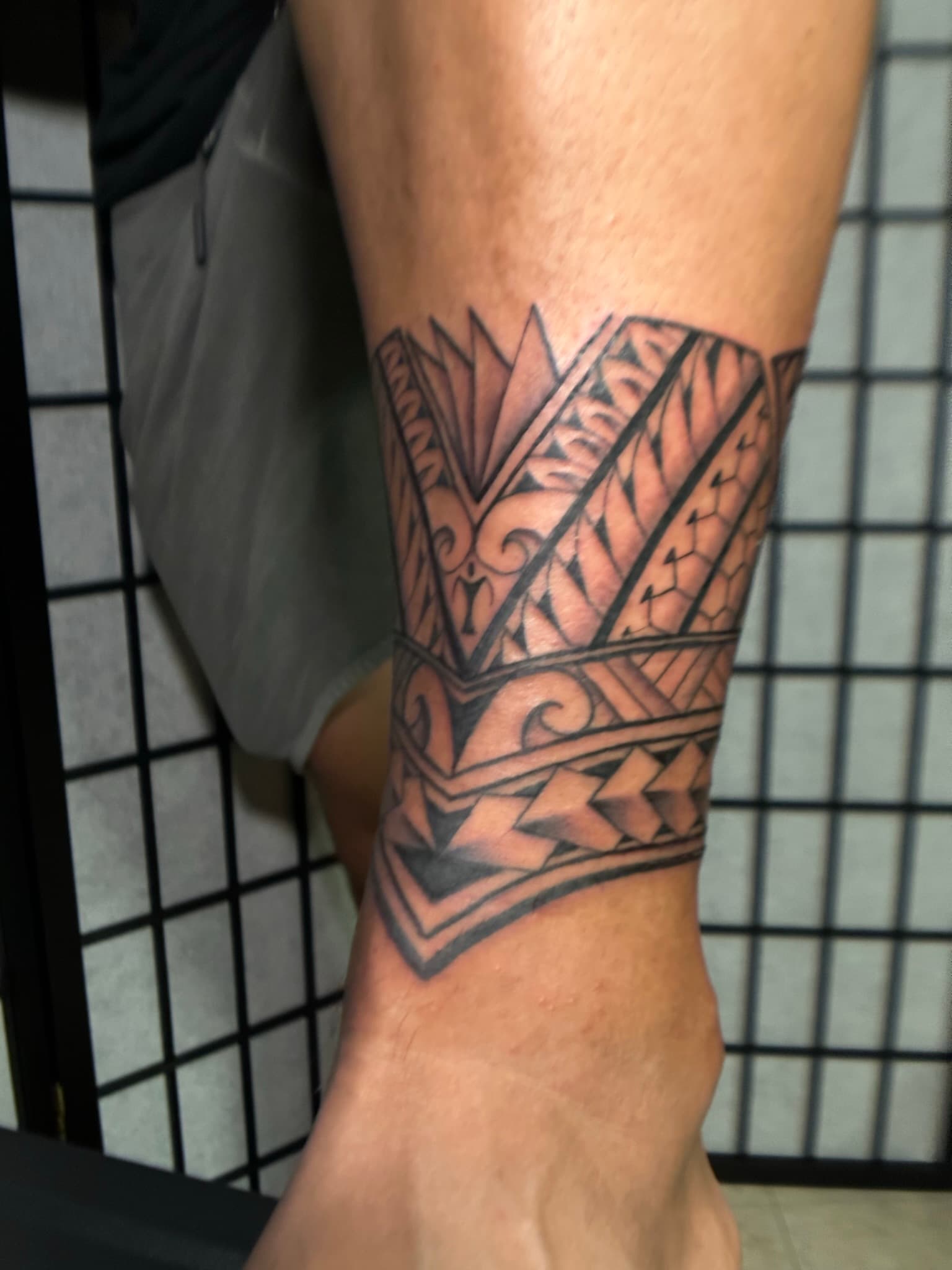 Custom Polynesian tribal ankle cuff tattoo by Isaac Mackenzie