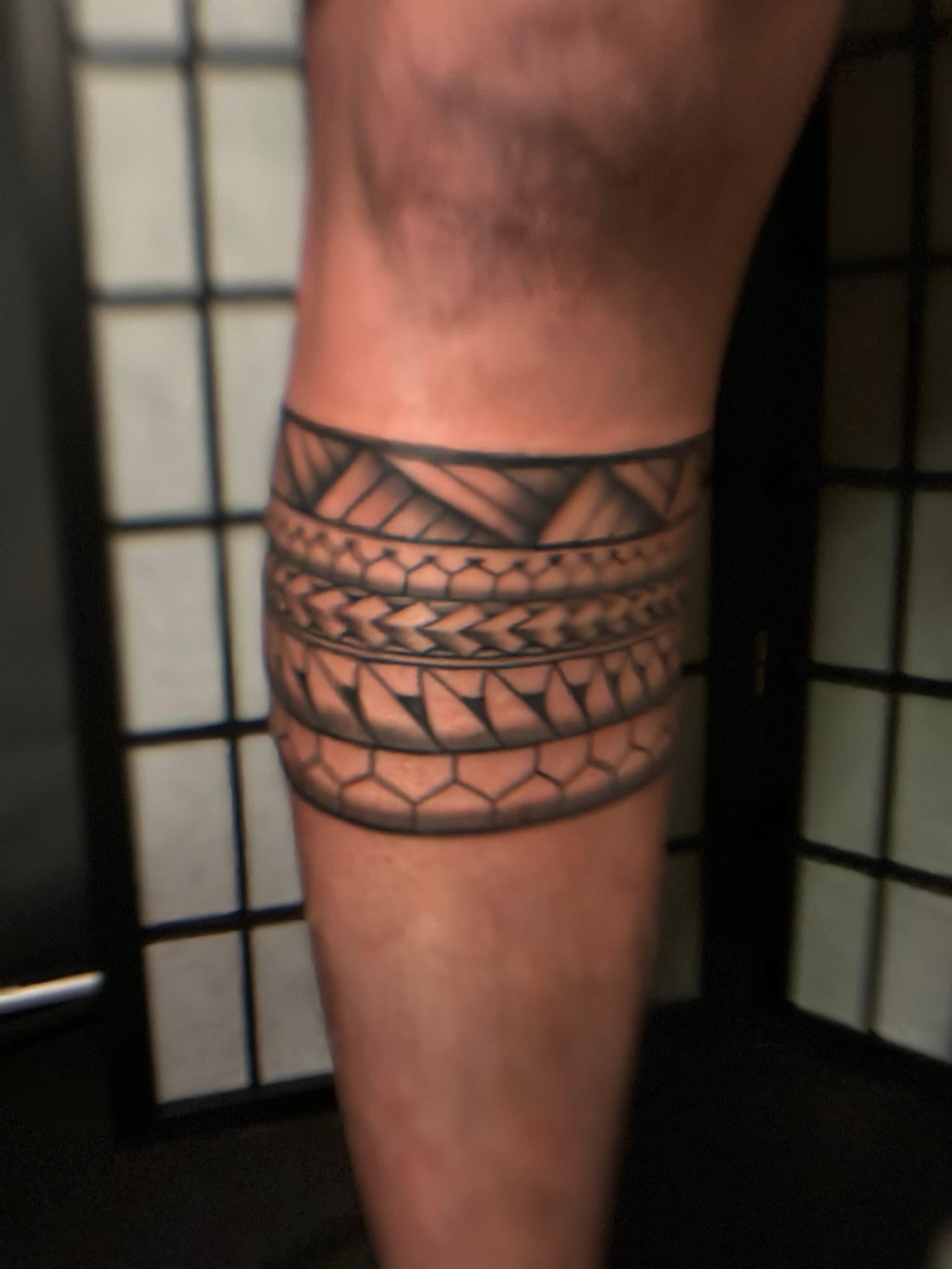 Custom Polynesian tribal calf band tattoo by Isaac Mackenzie, Hawaii