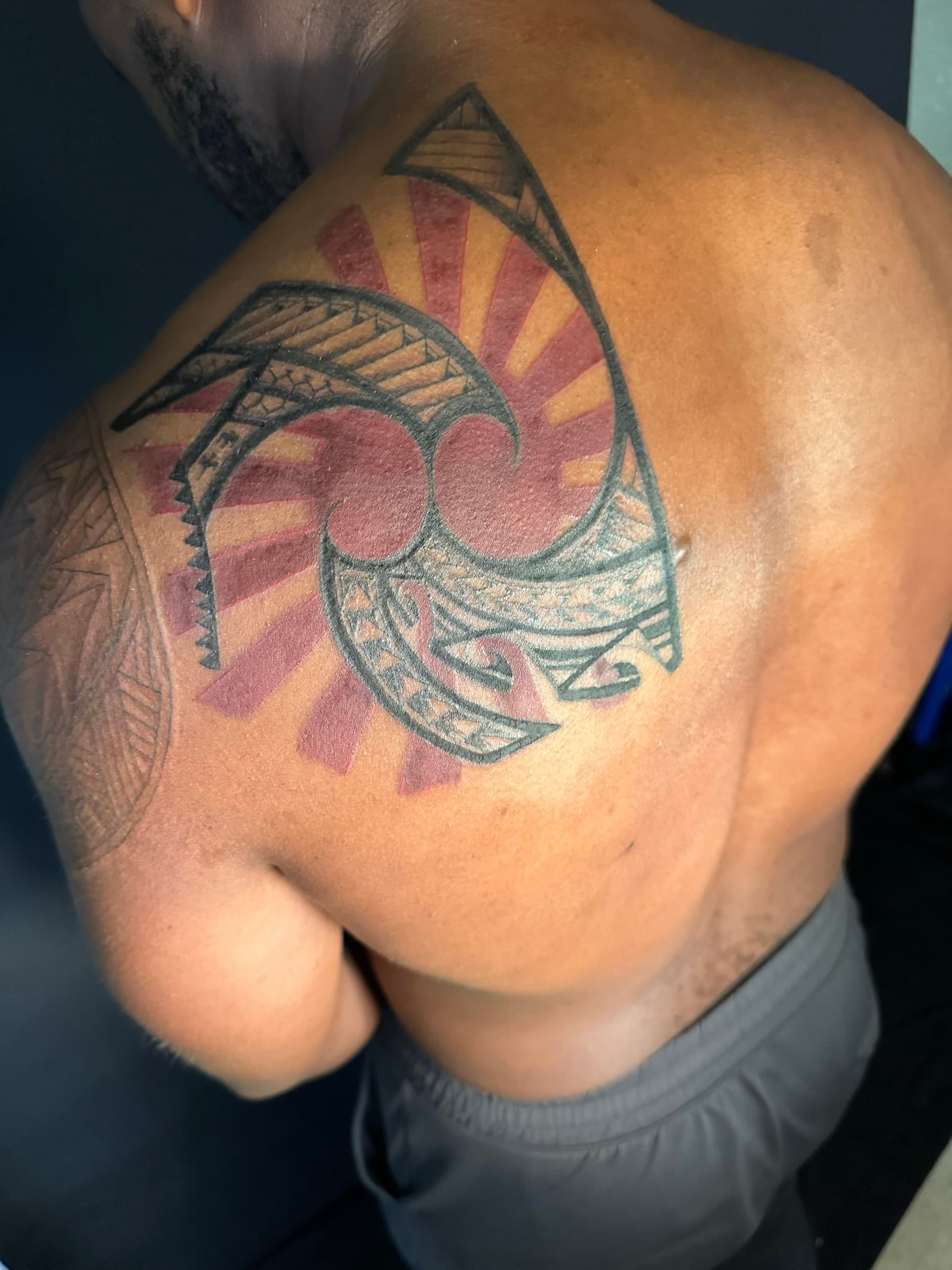 Polynesian tribal sun design tattoo by Isaac Mackenzie, Oahu