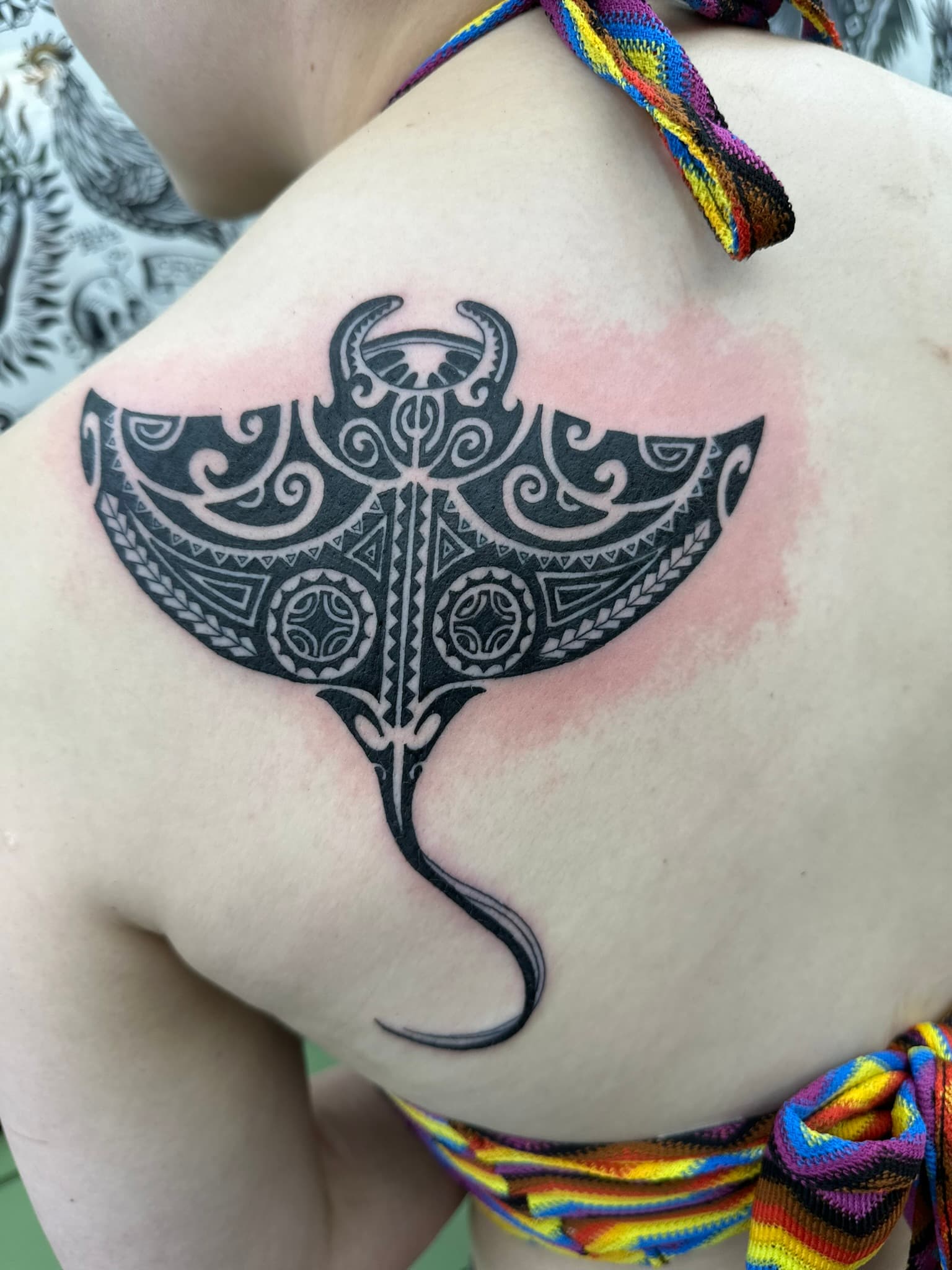 Polynesian tribal manta ray shoulder tattoo by Isaac Mackenzie, Hawaii