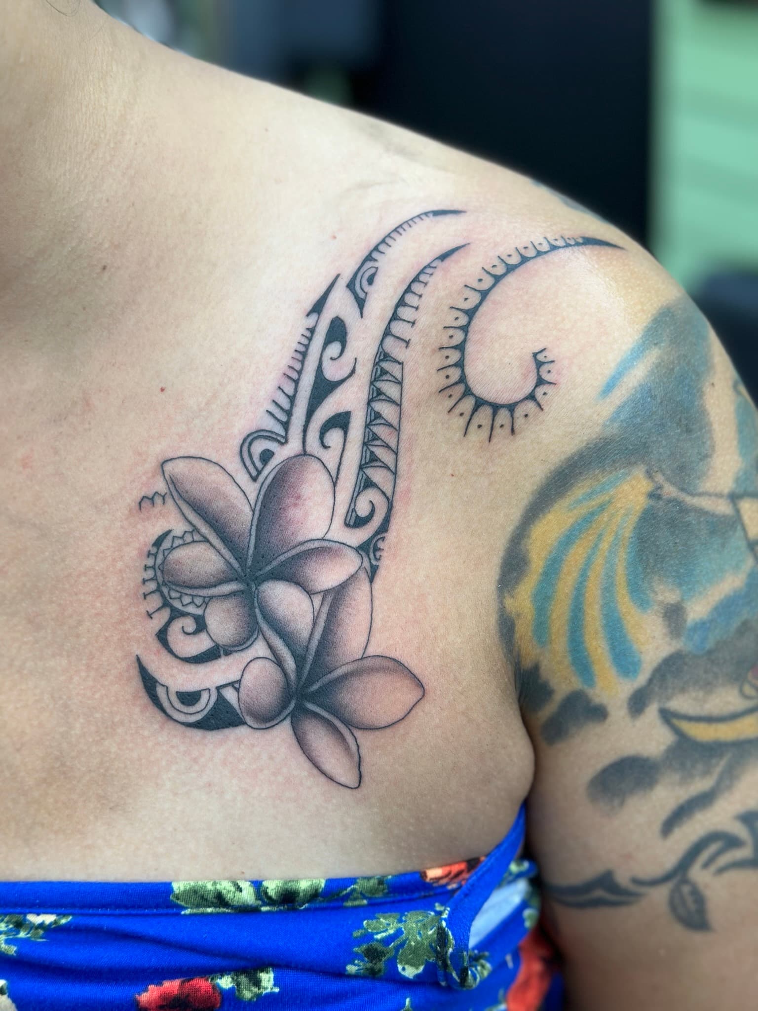 Polynesian tribal plumeria tattoo by Isaac Mackenzie, Hawaii