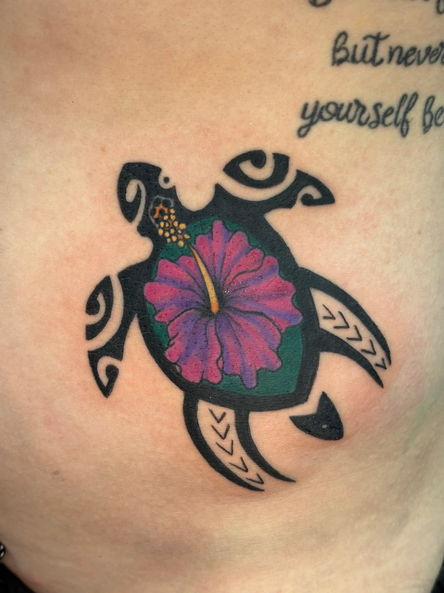 Polynesian tribal turtle with color hibiscus tattoo by Isaac Mackenzie, Oahu