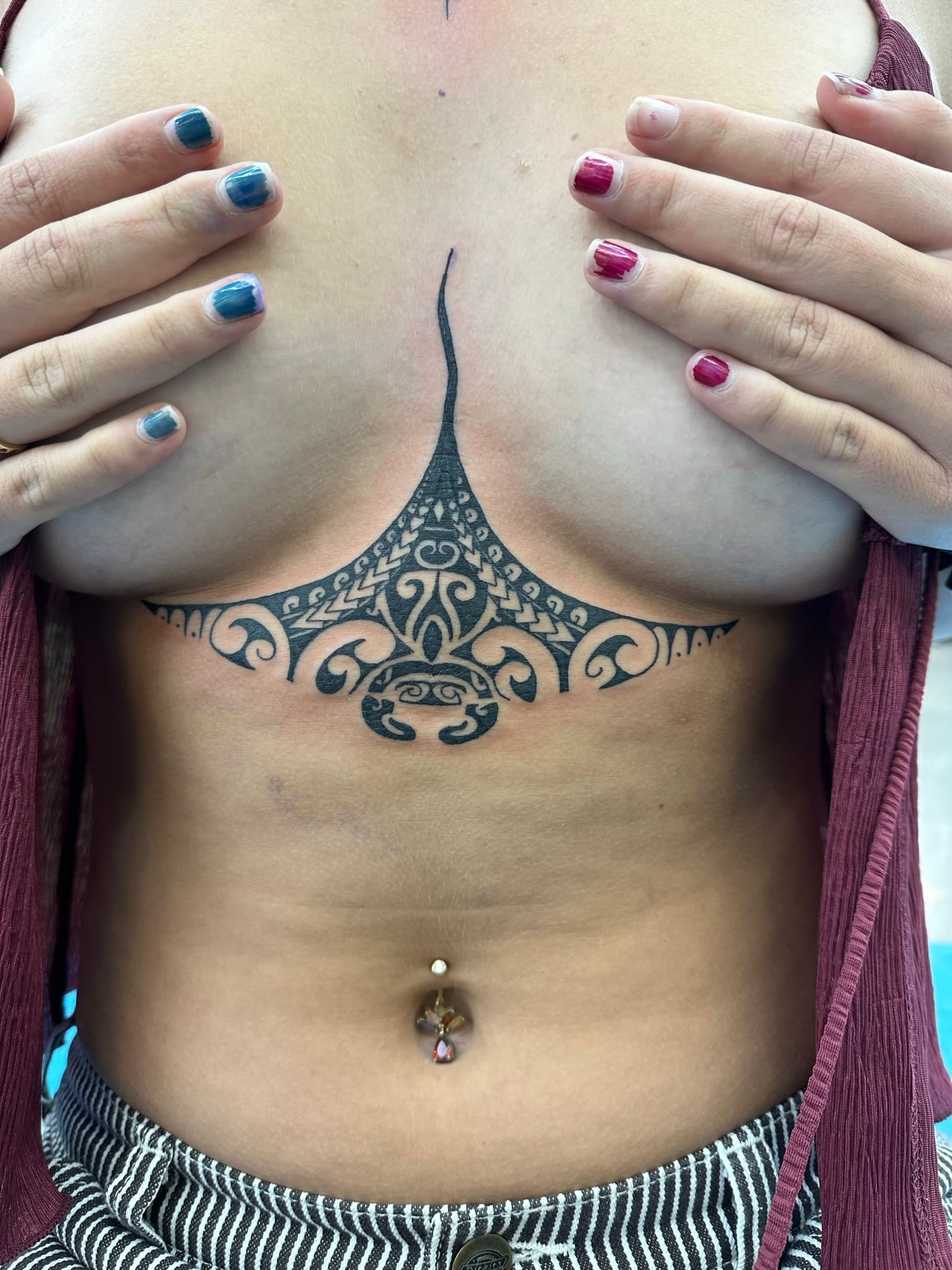 Polynesian tribal manta ray underboob flash by Isaac Mackenzie