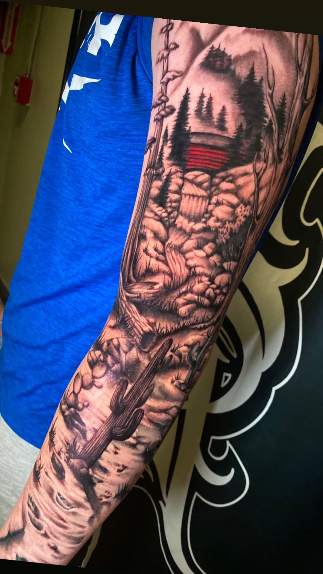 Realism forest cabin and desert landscape sleeve tattoo, Oahu