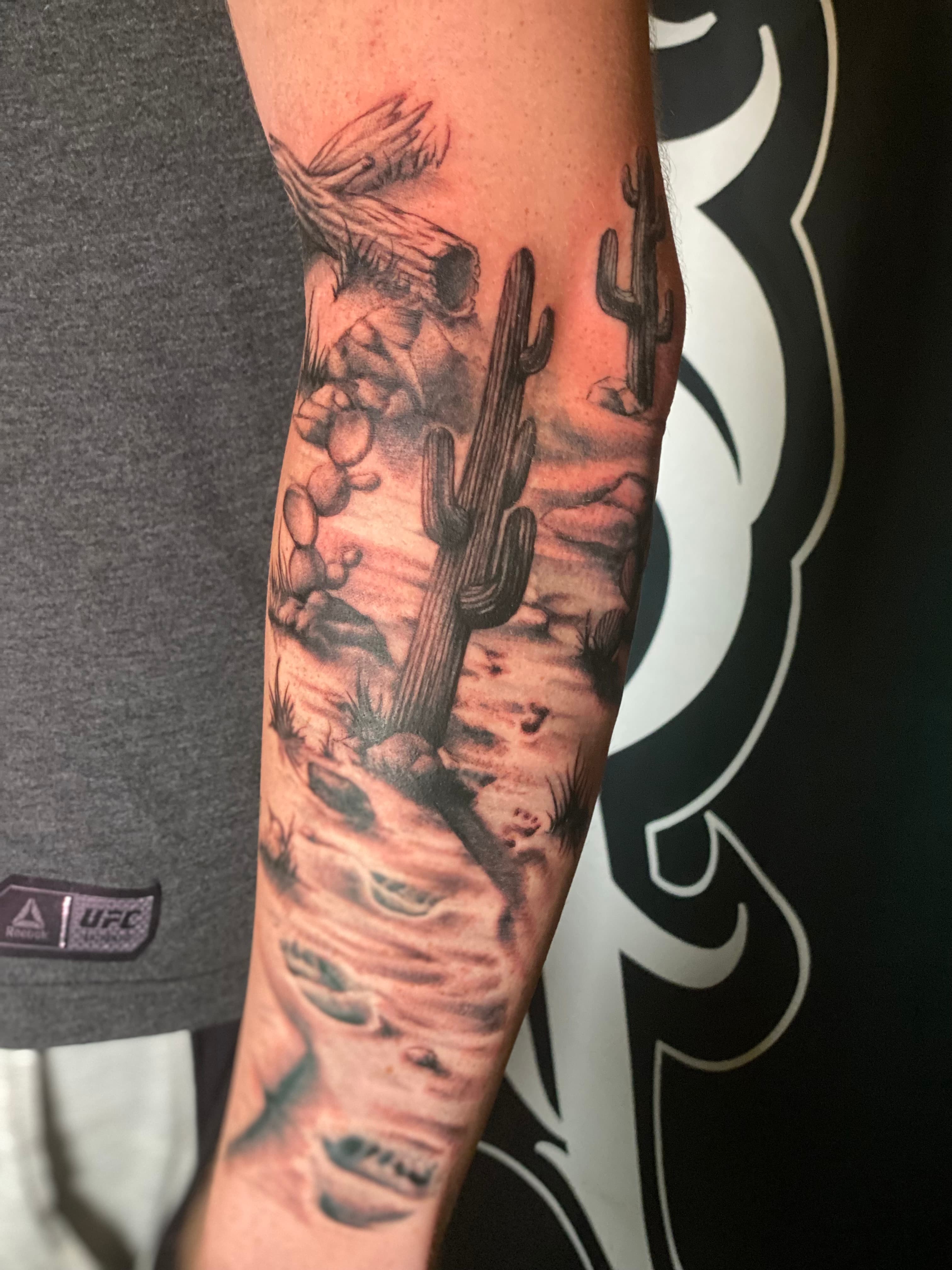 Realism desert landscape rework tattoo by Isaac Mackenzie