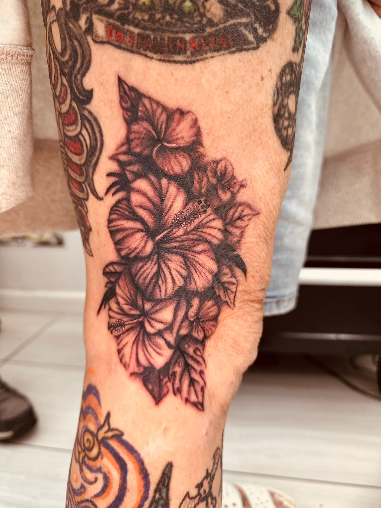 Realism hibiscus flower tattoo by Isaac Mackenzie