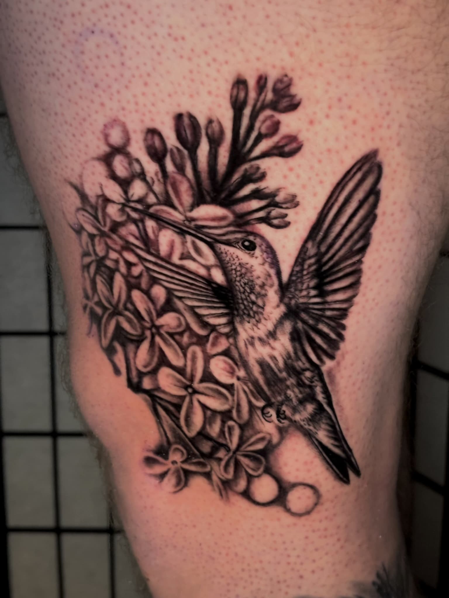 Color realism hummingbird with florals tattoo