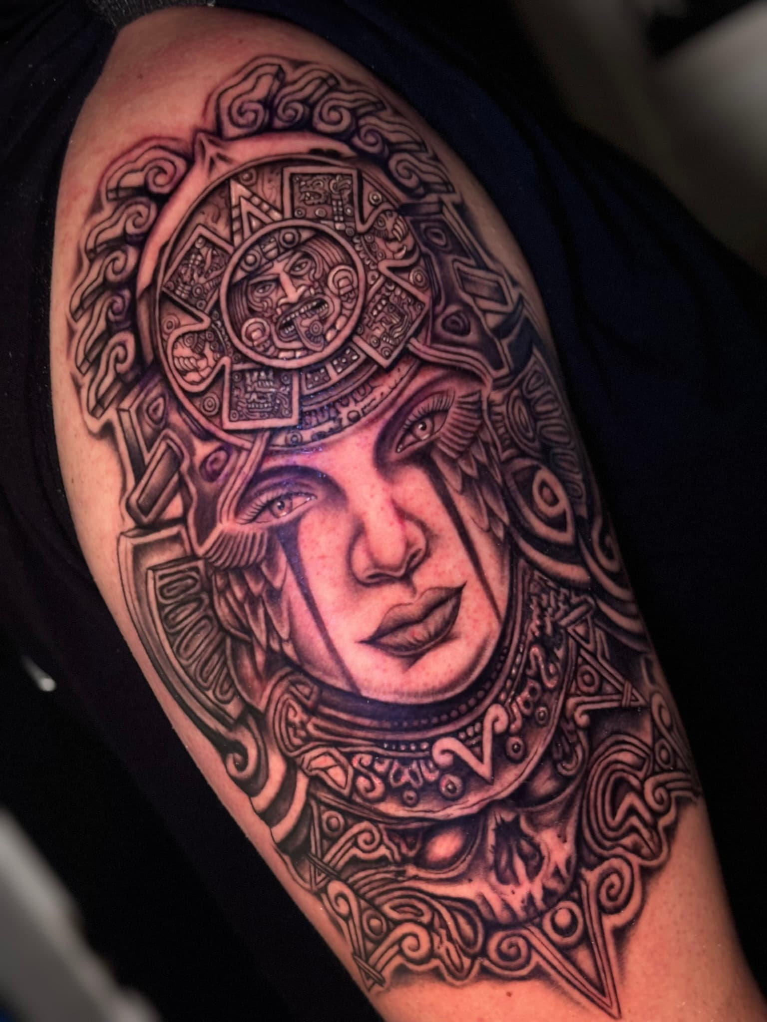 Realism Mexican sun stone headdress tattoo by Isaac Mackenzie