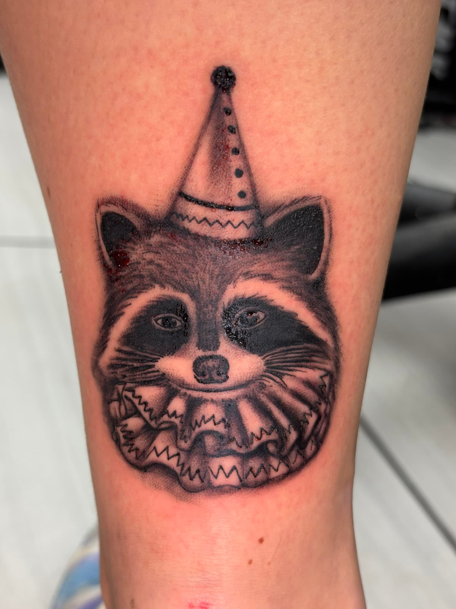 Realism party raccoon tattoo by Isaac Mackenzie