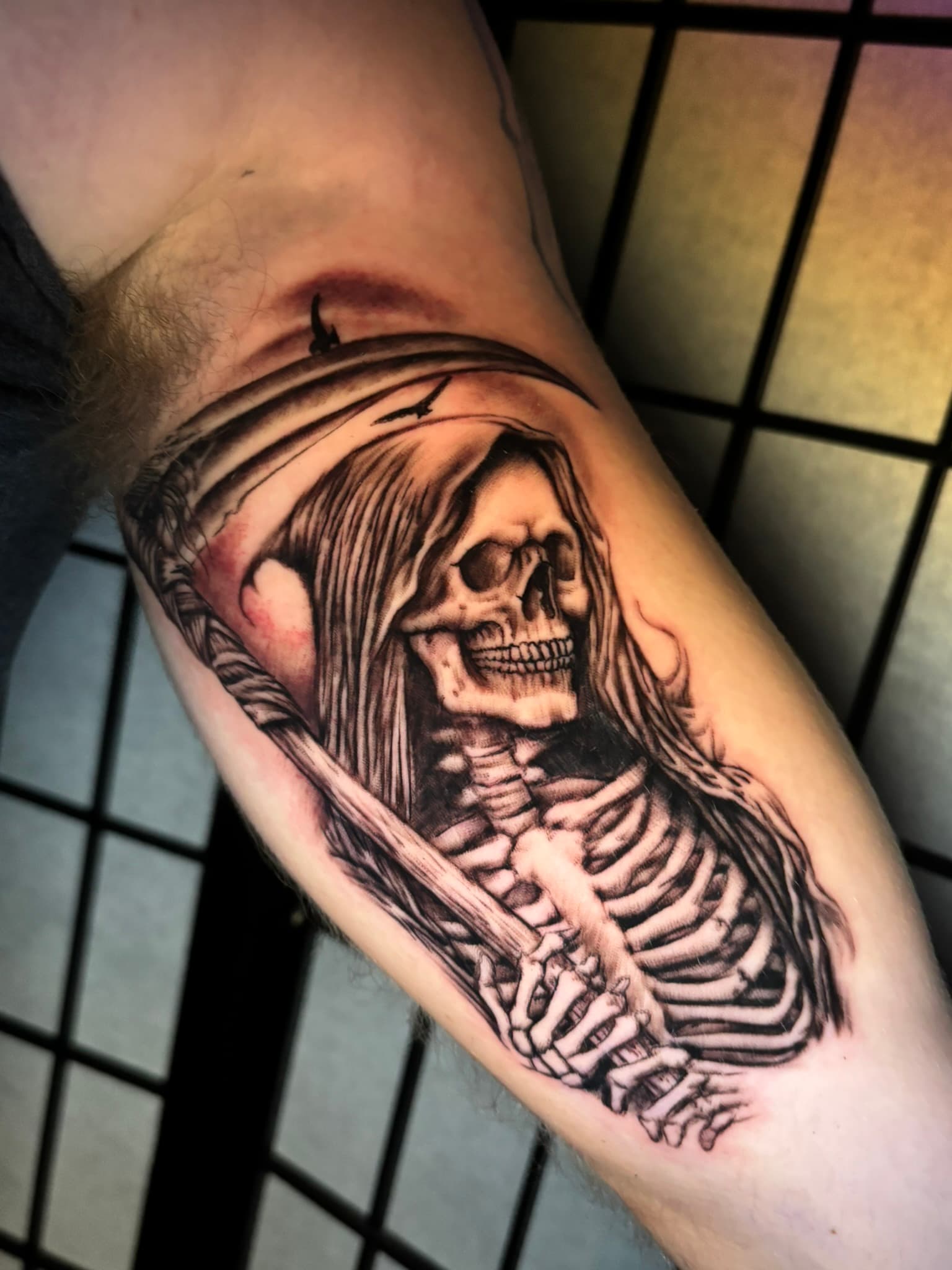 Black and grey realism grim reaper tattoo by Isaac Mackenzie