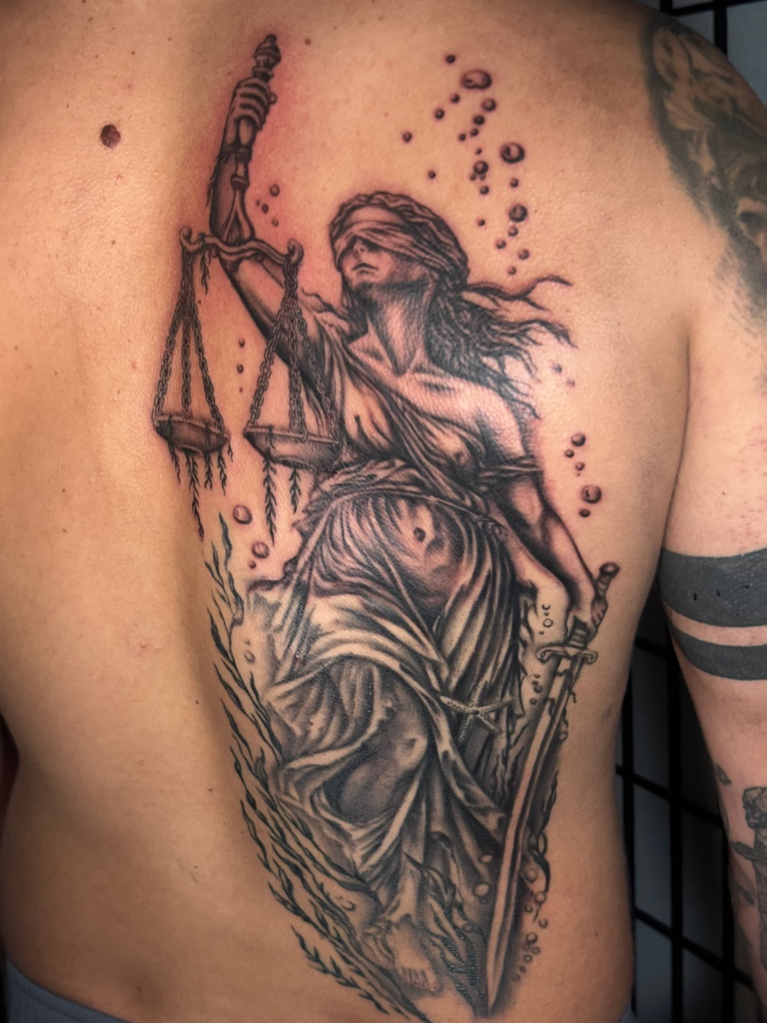 Realism underwater Lady Liberty tattoo by Isaac Mackenzie, Oahu