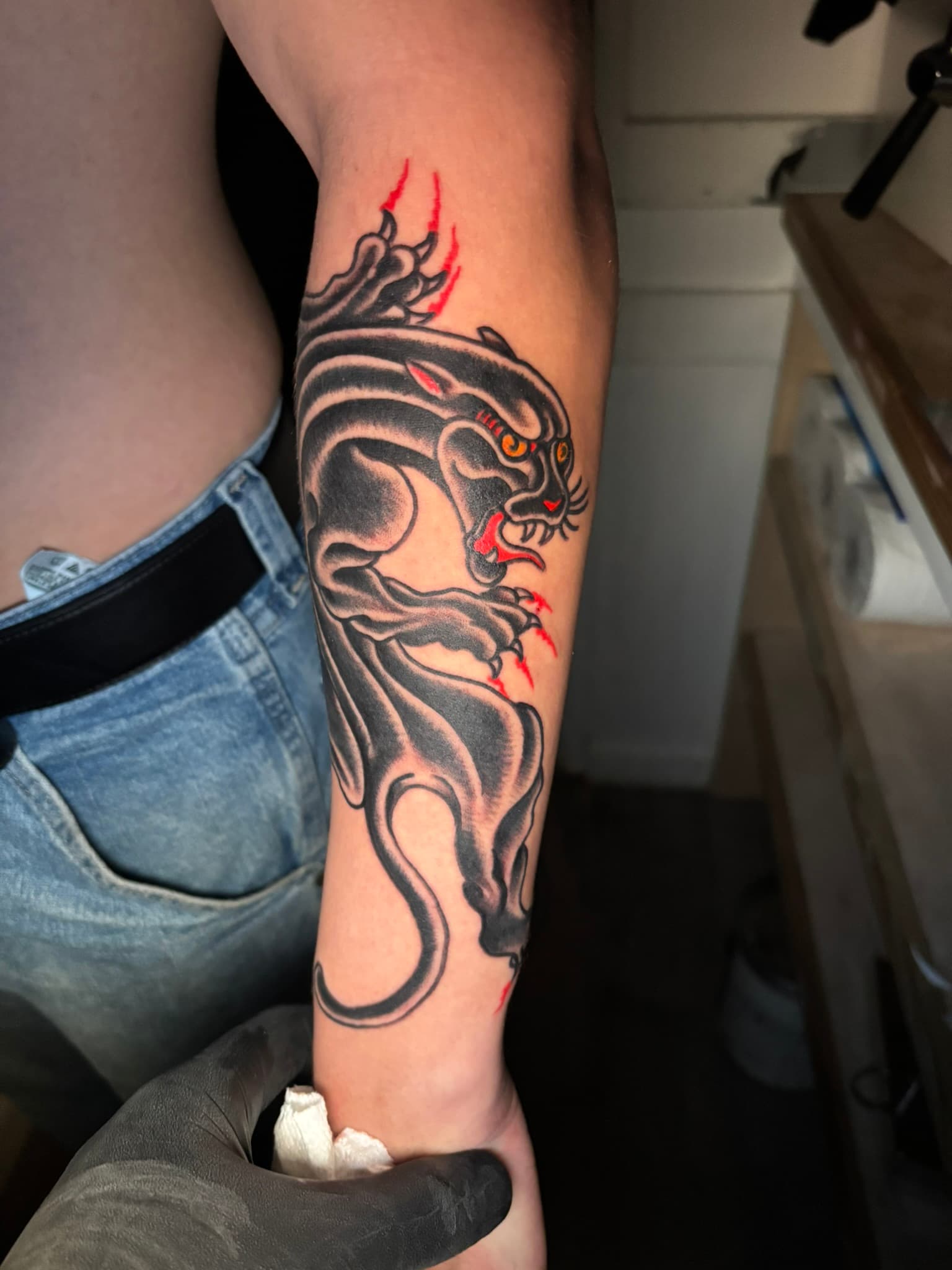 American traditional black panther forearm tattoo by Isaac Mackenzie at TNT Tattoo, Aiea, Oahu